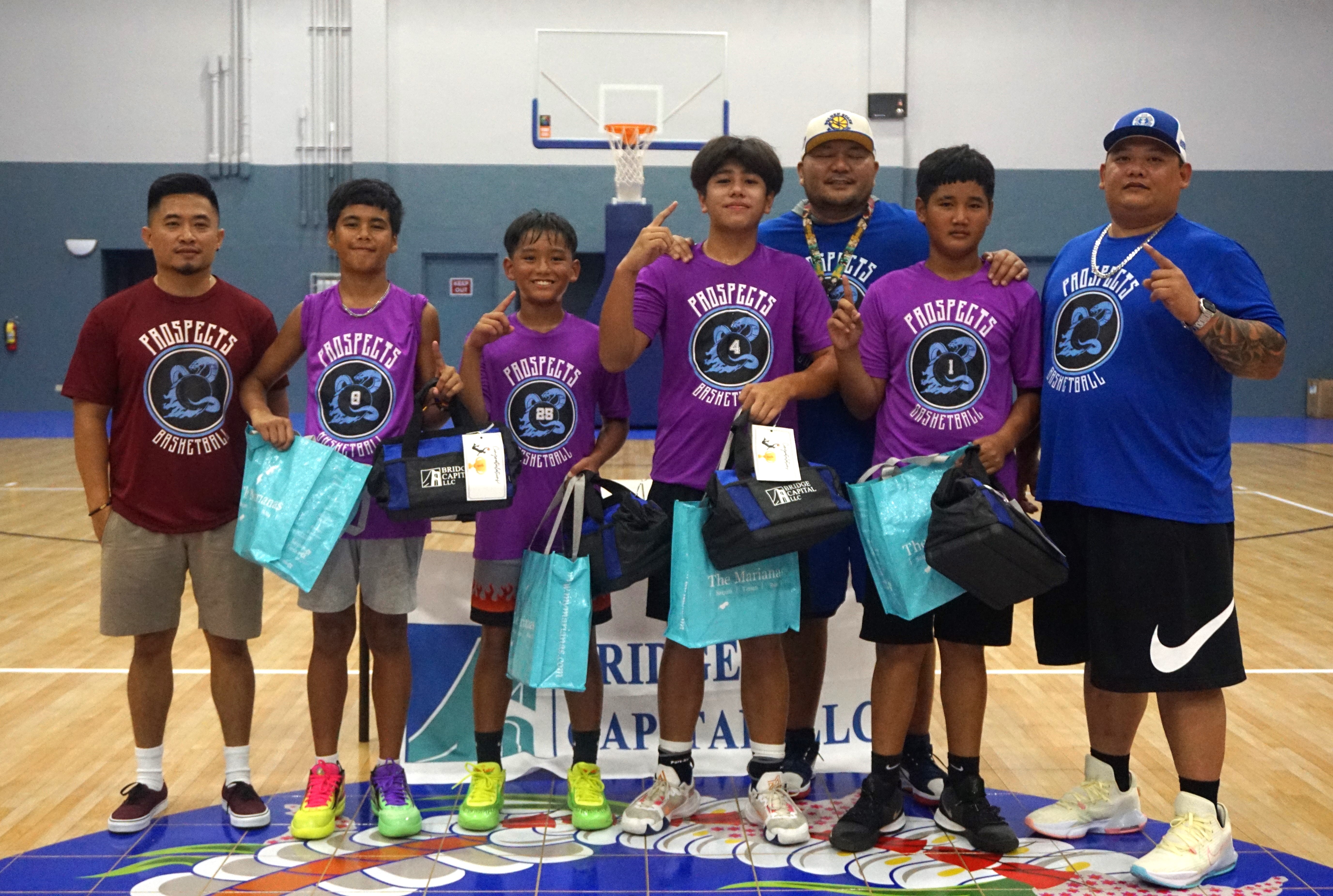 The Lakers pose with their  coach Matt Duenas and Prospects Basketball Club co-founders Mike Mercado and John Apatang during the awards ceremony of the in-house 3x3 basketball tournament hosted by Prospects Basketball Club on Saturday at the Ada gym.