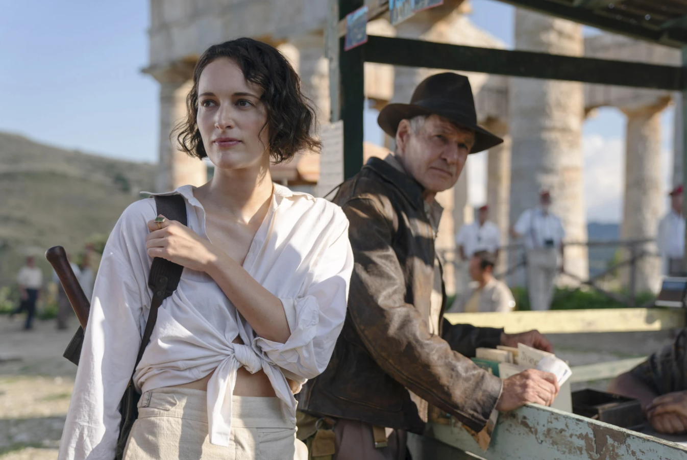This image released by Lucasfilm shows Ethann Isidore, from left, Harrison Ford and Phoebe Waller-Bridge in a scene from "Indiana Jones and the Dial of Destiny."