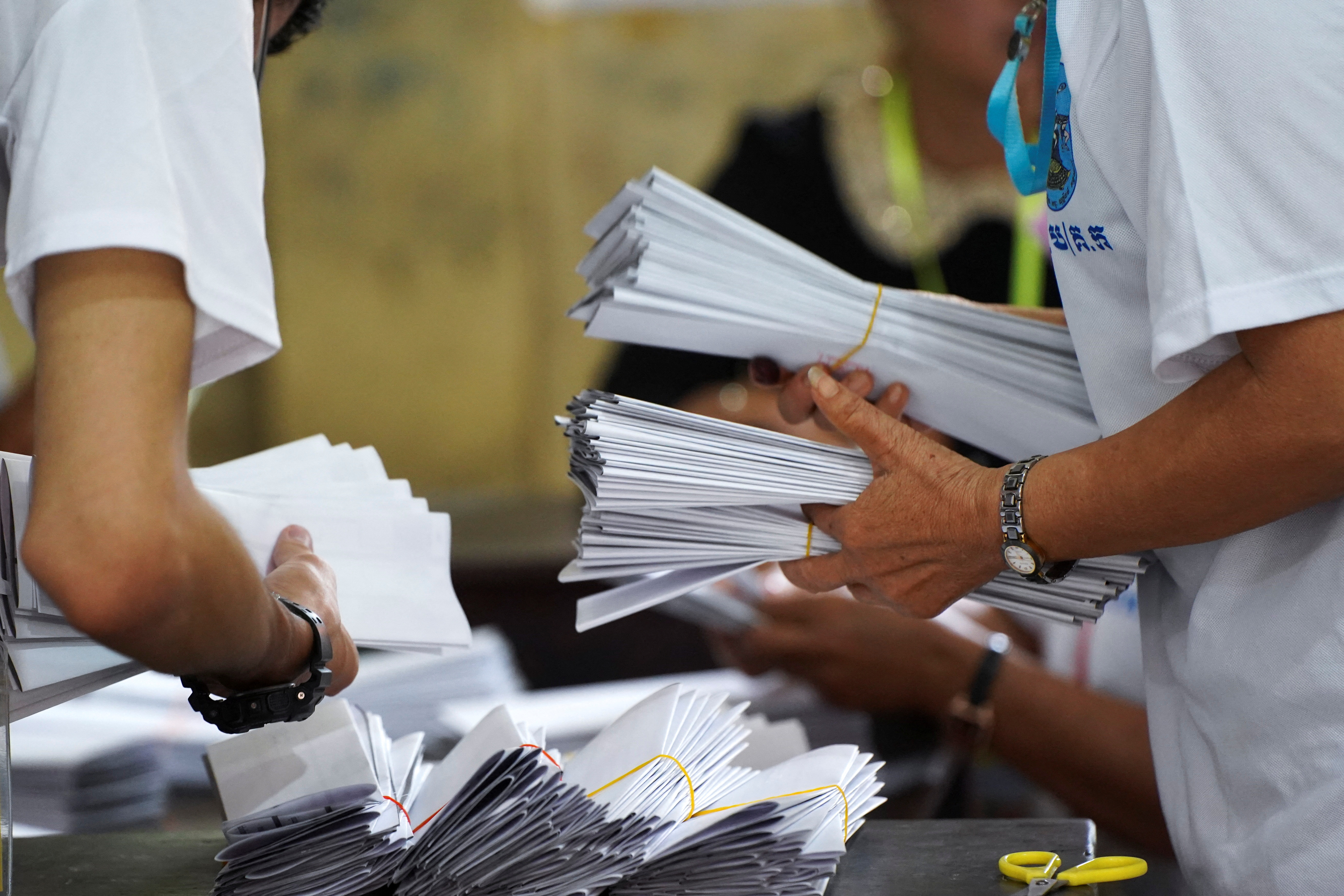 Election officials count ballots at a polling station on the day of Cambodia's general election, in Phnom Penh, Cambodia, July 23, 2023. REUTERS/Cindy Liu