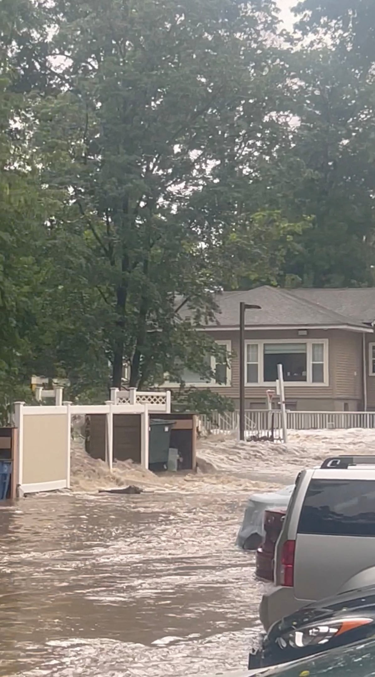 Streets are flooded in Highland Falls, Orange County, U.S., in this video screengrab obtained from social media, July 9, 2023. Melissa Roberts/via REUTERS/File photo
