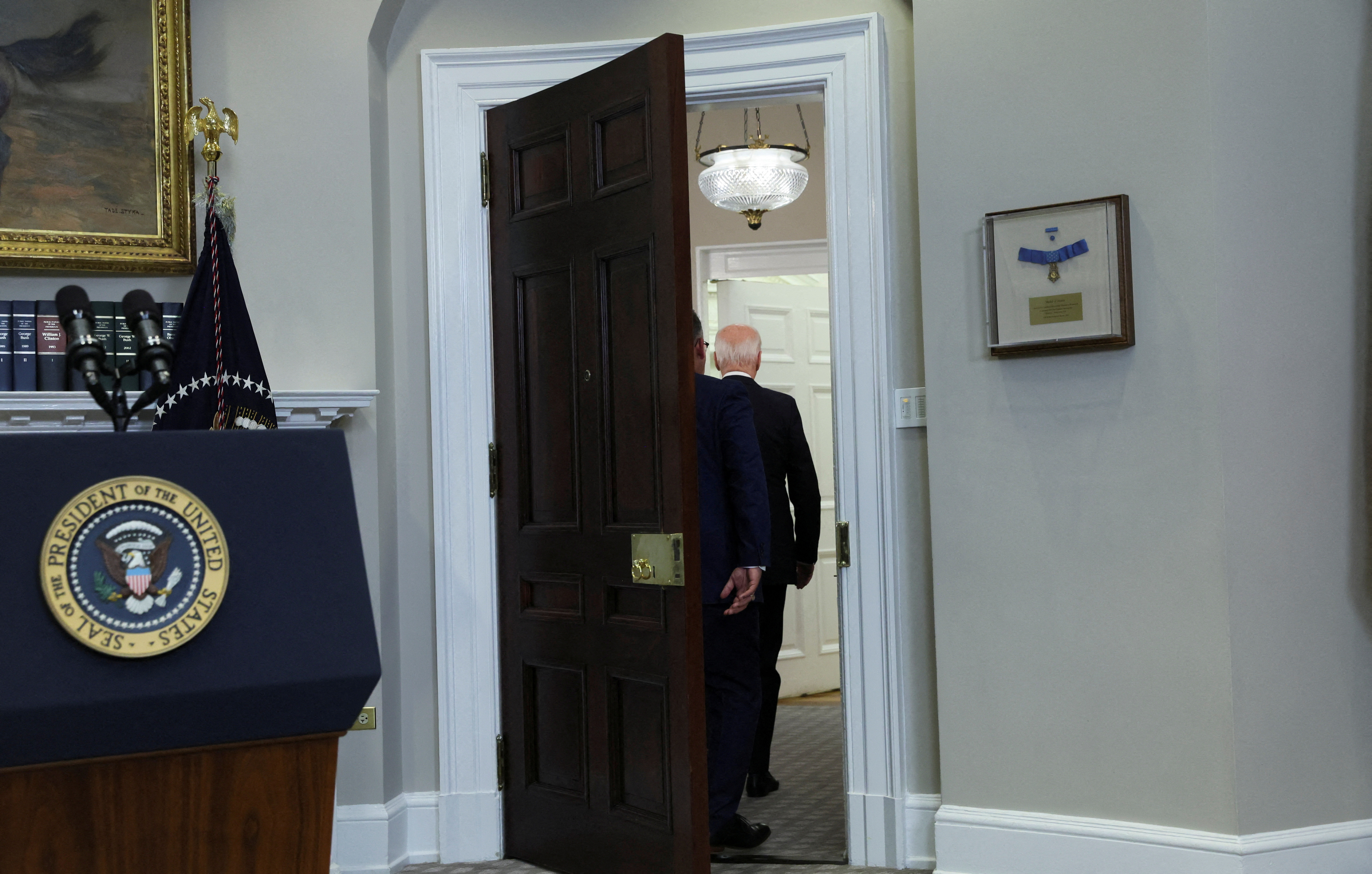 FILE PHOTO: U.S. President Joe Biden leaves the Roosevelt Room with Education Secretary Miquel Cardona after speaking about their plans for continued student debt relief after a U.S. Supreme Court decision blocking his plan to cancel $430 billion in student loan debt, at the White House in Washington, U.S. June 30, 2023. REUTERS/Leah Millis