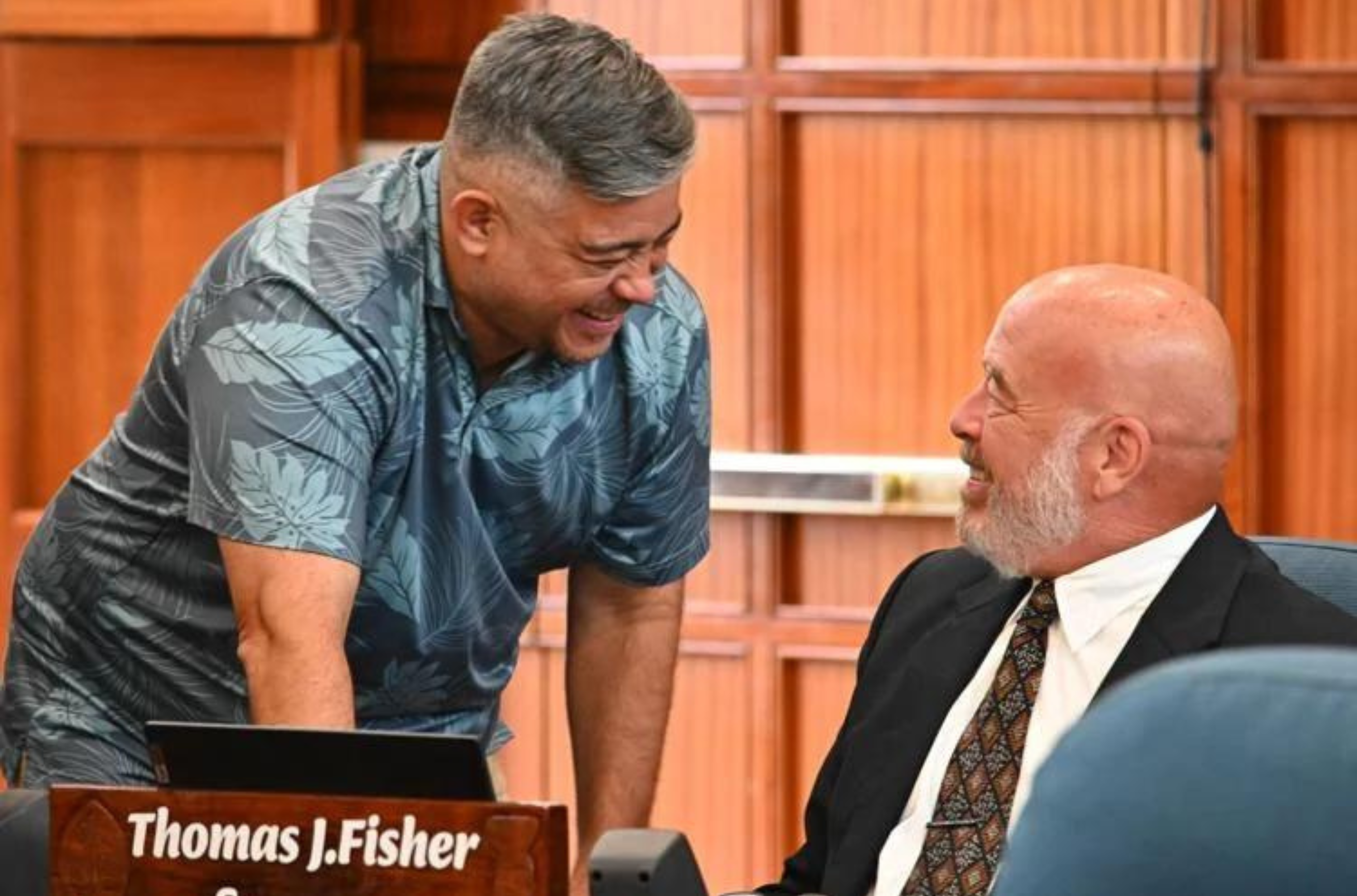 Sens. Chris Barnett, left, and Thomas Fisher talk together as Bill 65-37 is discussed during session Monday, July 24, 2023, at the Guam Congress Building in Hagåtña.