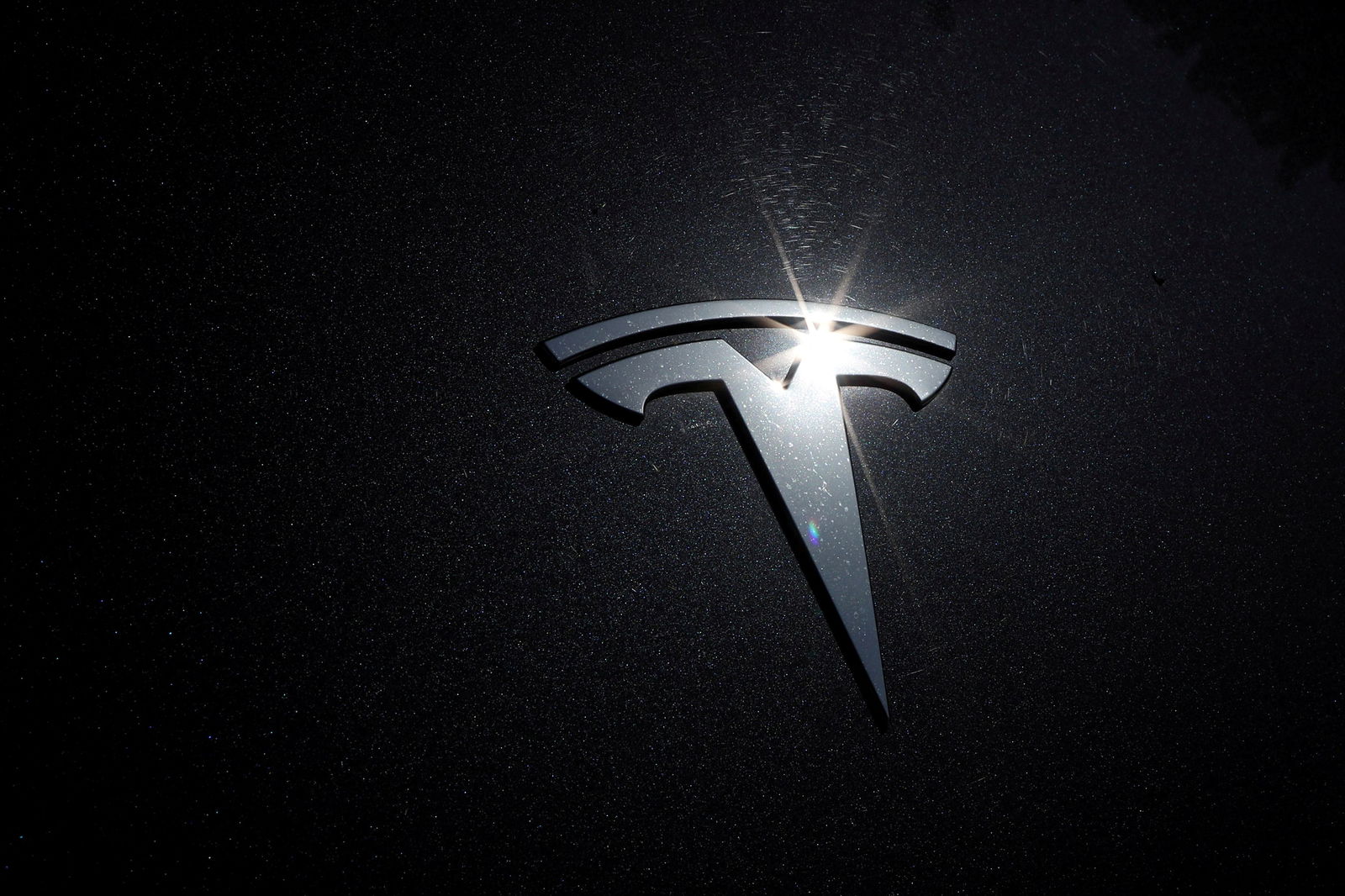 The Tesla logo is seen on a car in Los Angeles, California, July 9, 2020.