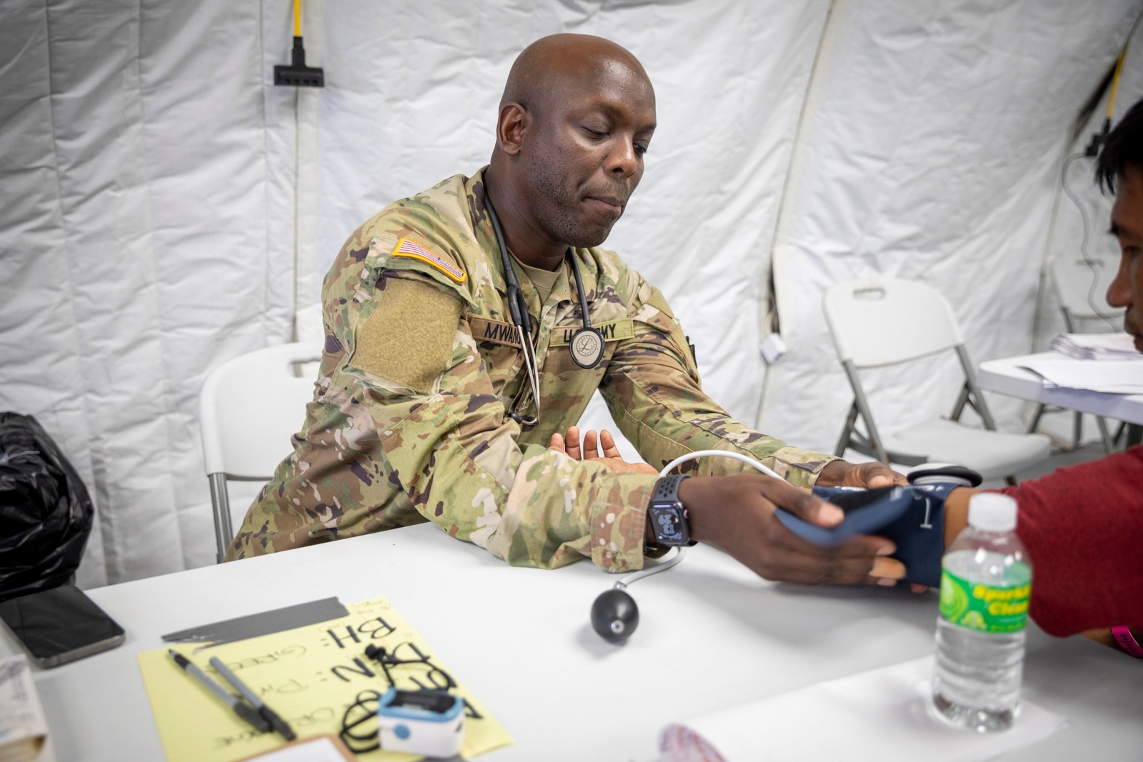 A soldier conducts a medical exam at the Commonwealth Healthcare Corporation Medical Care and Treatment Site (CHCC MCATS) as part of Operation Wellness CNMI of the Innovative Readiness Training program under the US Department of Defense. 