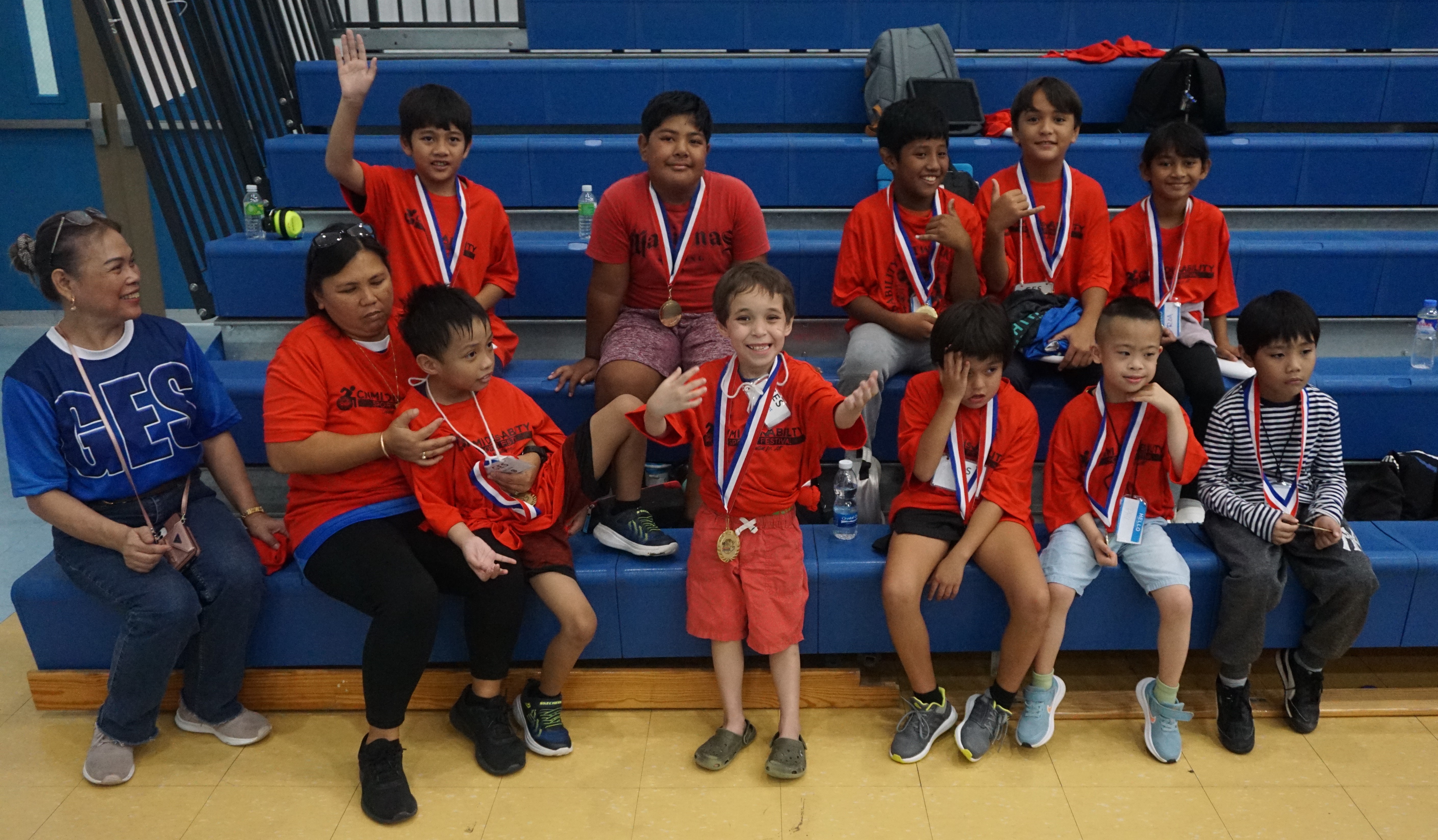 Participants pose with their medals during the 3rd CNMI Disability Sports Festival on Friday at the Marianas High School gym.