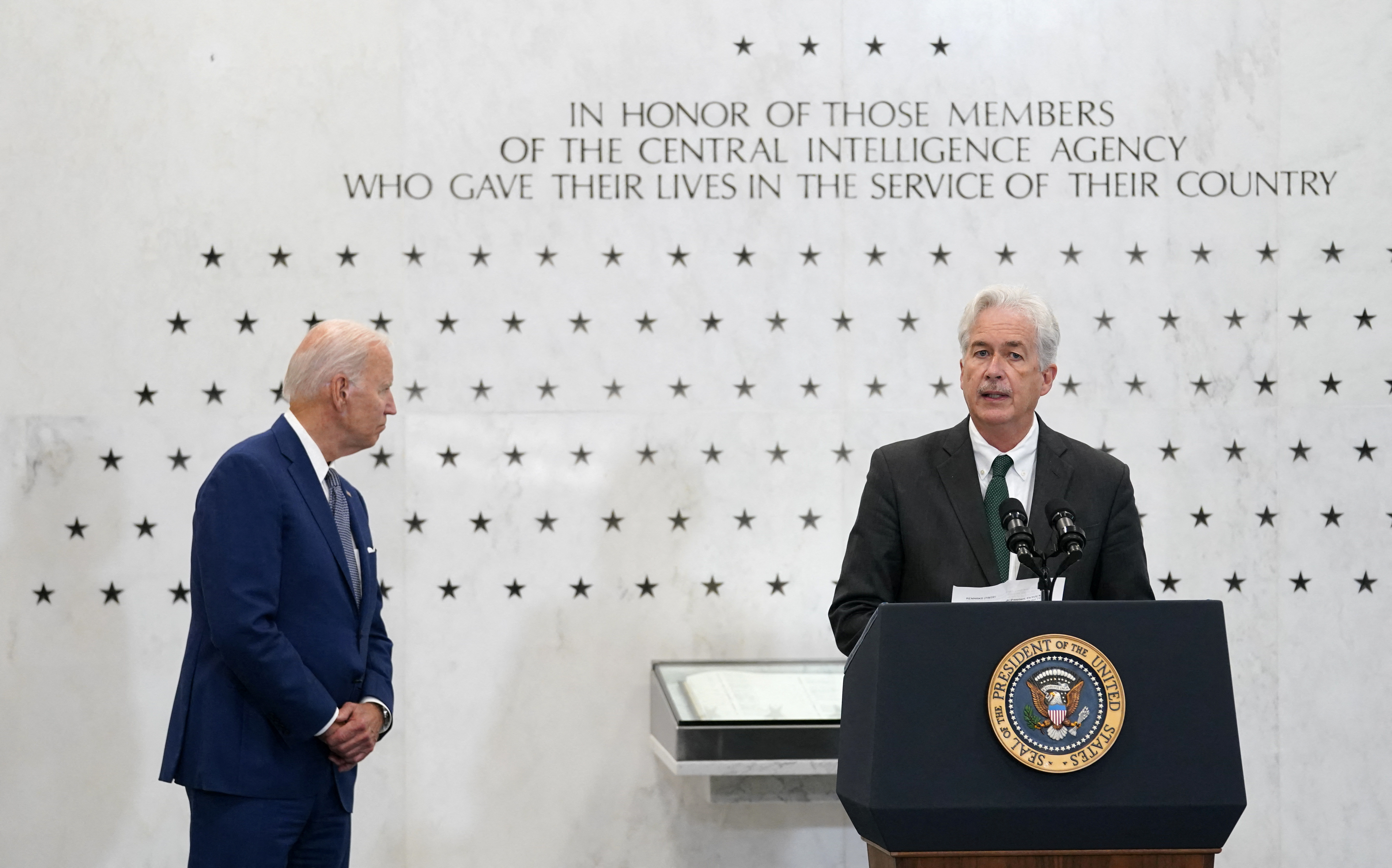 U.S. President Joe Biden looks at the Memorial Wall as he is introduced to speak by Central Intelligence Agency Director William Burns at CIA Headquarters in Langley, Virginia, U.S., July 8, 2022. REUTERS/Kevin Lamarque/File Photo