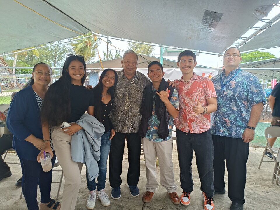 Lt. Gov. David M. Apatang, center, poses for a photo with Saipan and Northern Islands Council member Carmen C. Pangelinan, left, Speaker of the House Edmund Villagomez, right, and members of the CNMI Youth Congress