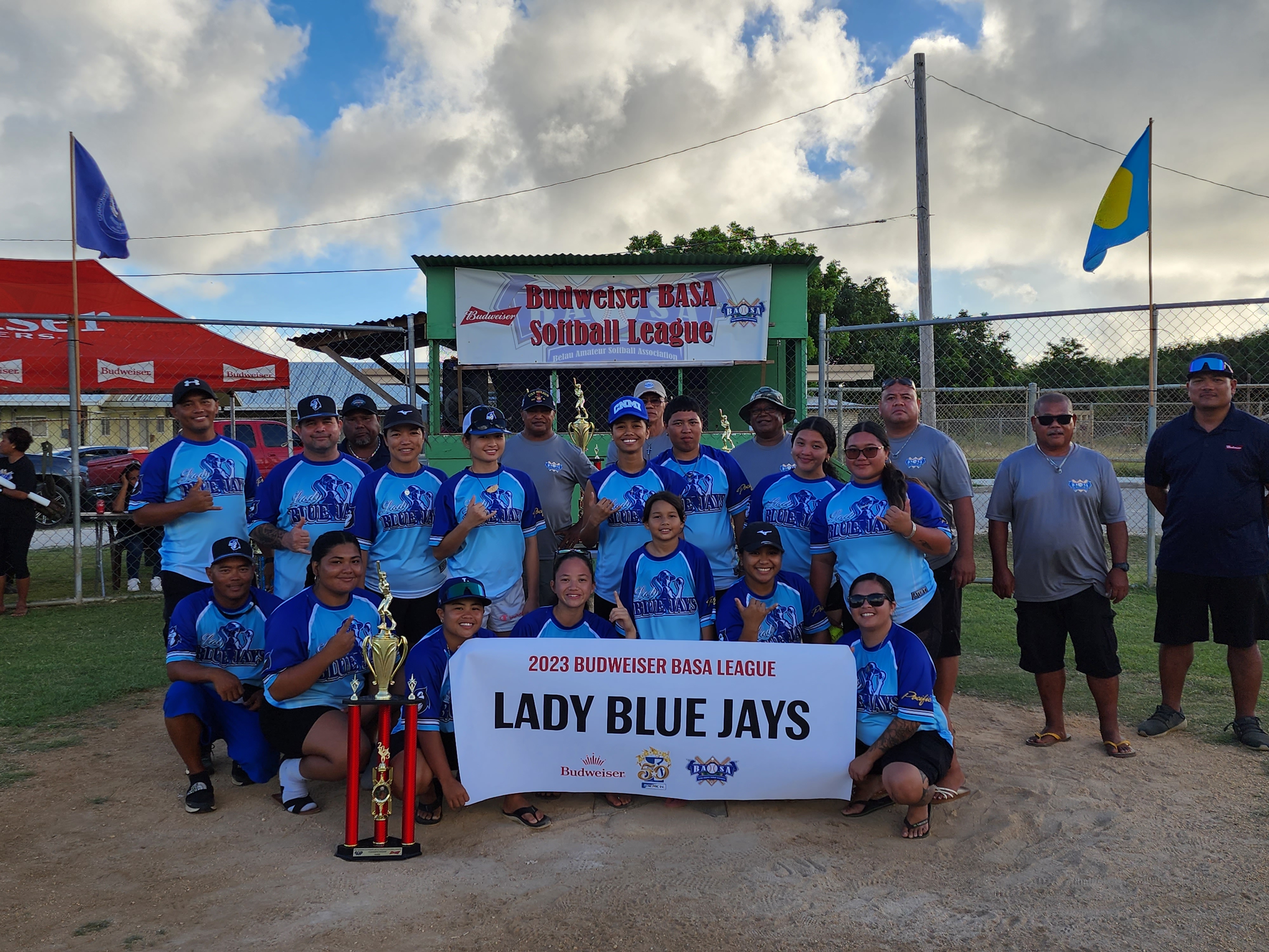 The Lady Blue Jays pose with the  division championship trophy of the 2023 Budweiser Belau Amateur Softball Association at the Dandan baseball field on Sunday.