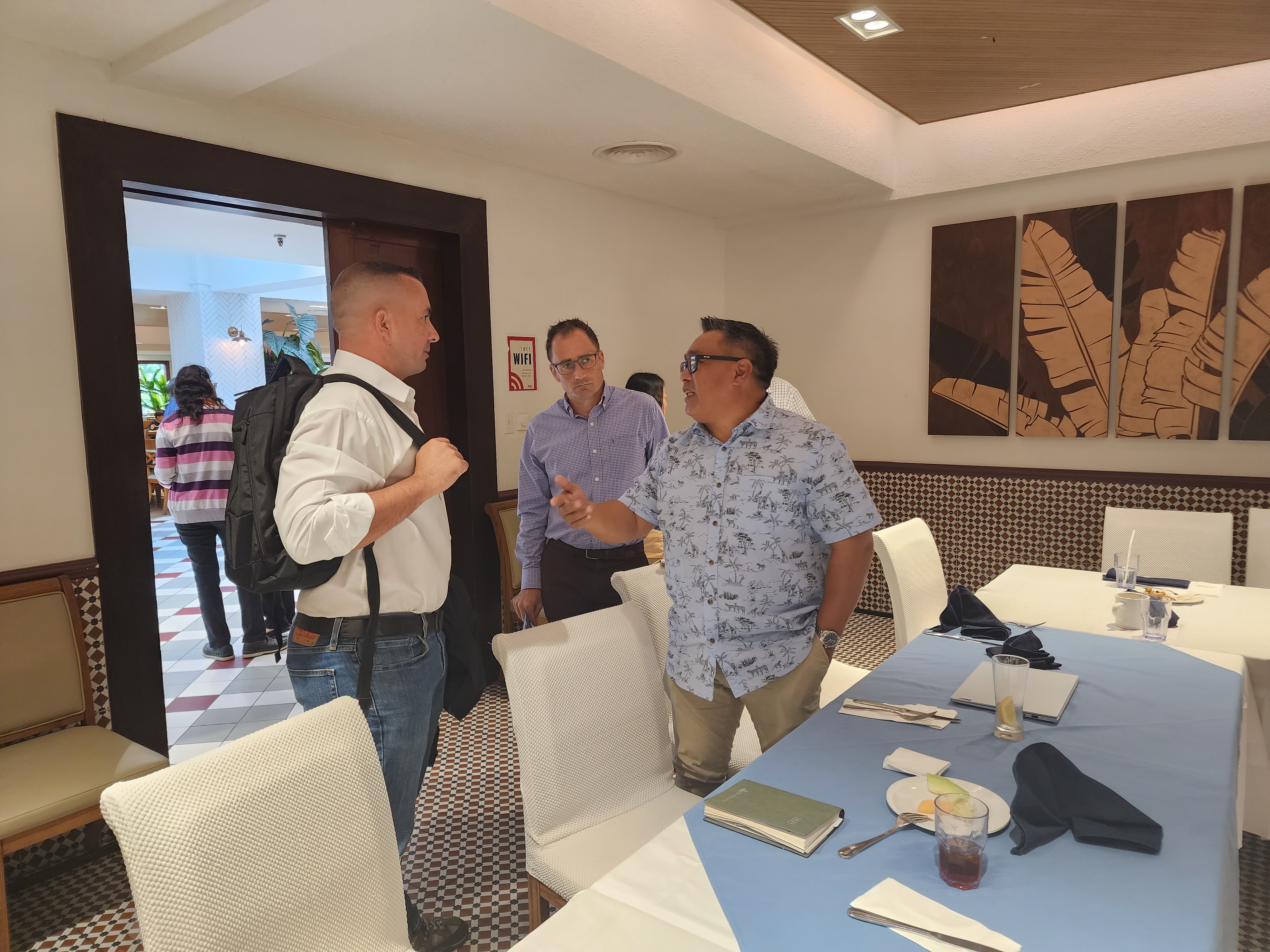 Hotel Association of the Northern Mariana Islands Chairman Ivan Quichocho, right, talks with Triple J Marketing Manager Brad Ruszala after a HANMI meeting at the Pacific Islands Club on Thursday