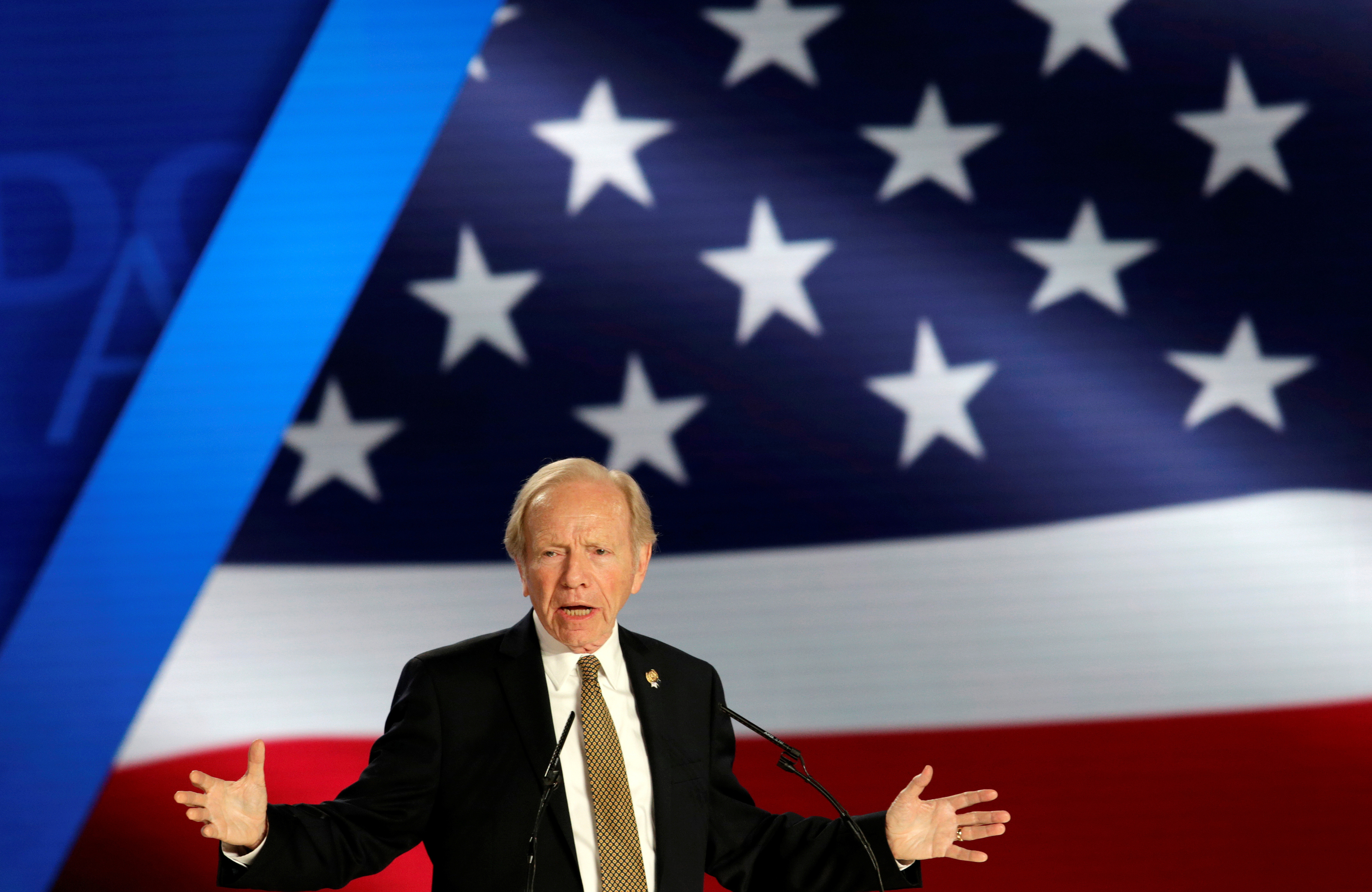 Former U.S. Senator Joe Lieberman speaks at an event in Ashraf-3 camp, which is a base for the People's Mojahedin Organization of Iran (MEK) in Manza, Albania, July 13, 2019. REUTERS/Florion Goga/FILE PHOTO