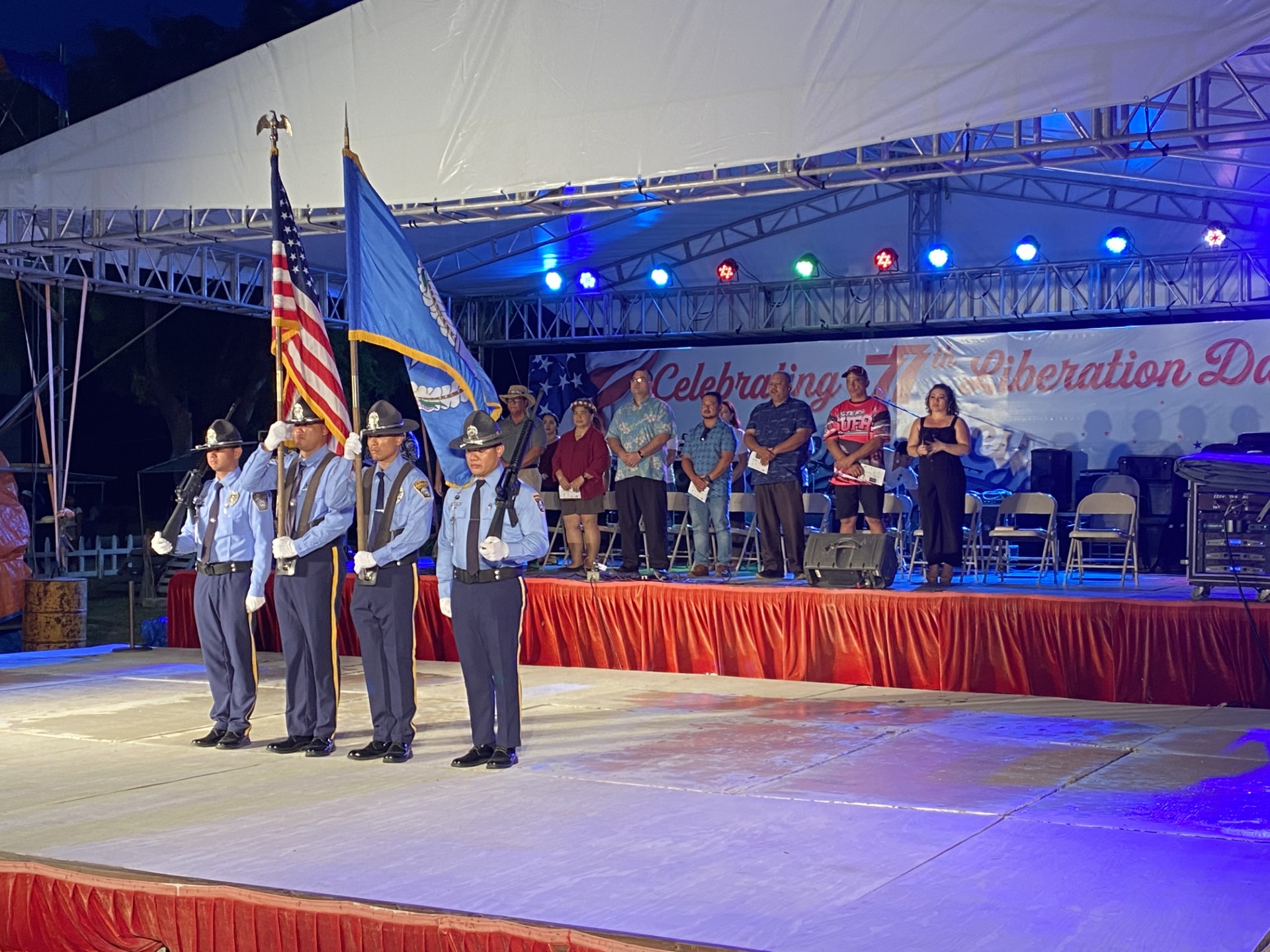 The Department of Public Safety color guard retires the colors during the closing ceremony of the 77th Liberation Day festivities.