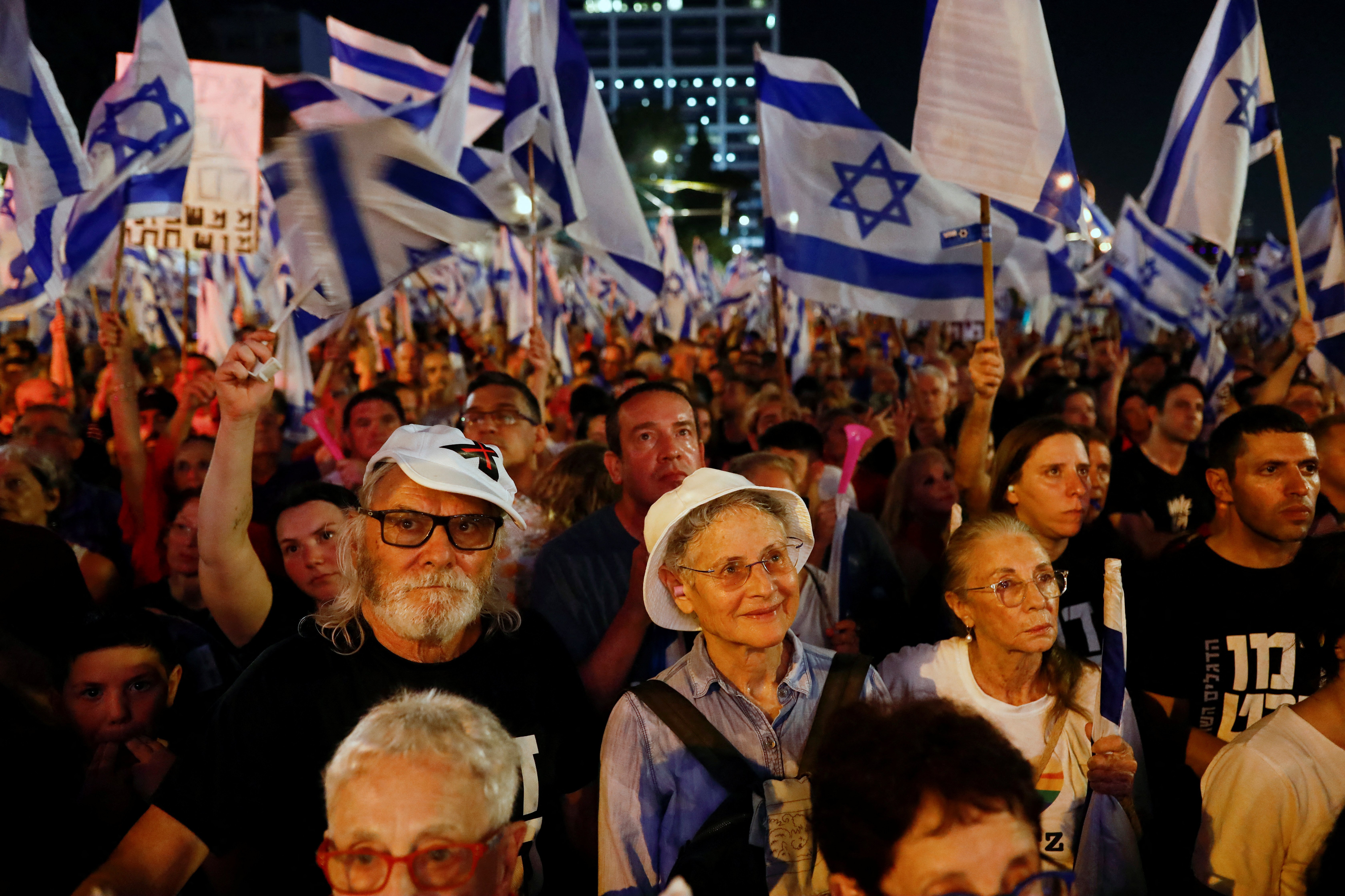 People take part in a demonstration against Israeli Prime Minister Benjamin Netanyahu and his nationalist coalition government's judicial overhaul, in Tel Aviv, Israel, July 22, 2023. REUTERS/Corinna Kern