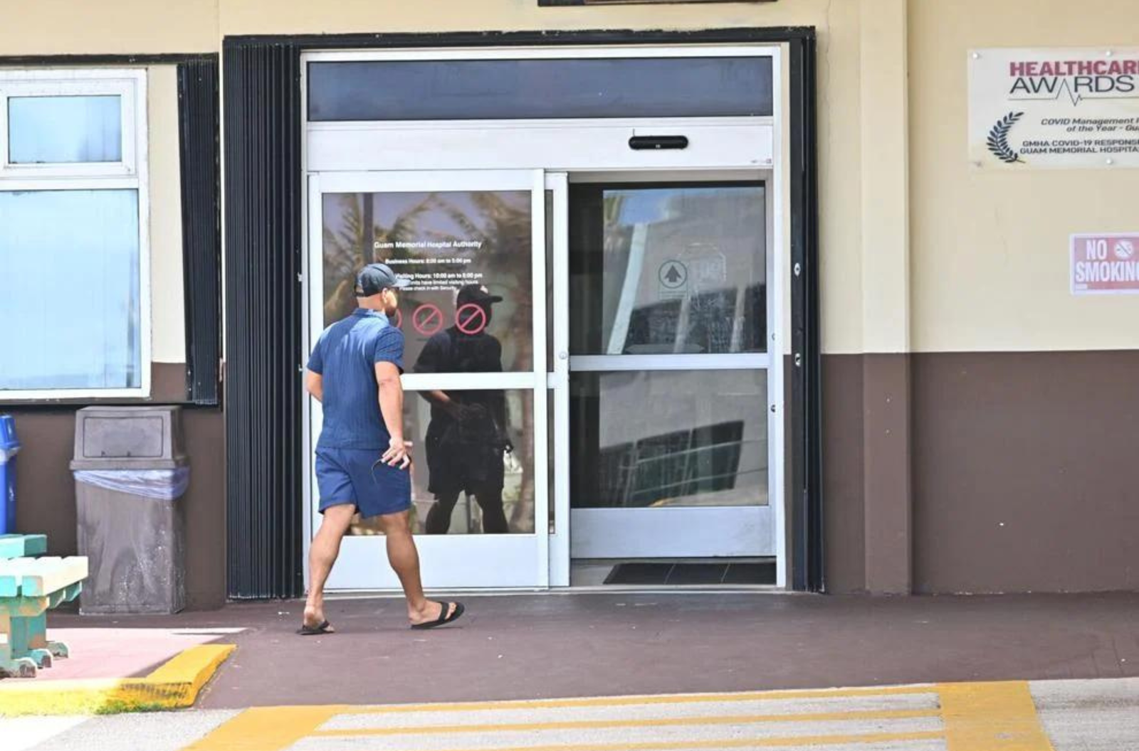 A person walks into the Guam Memorial Hospital entrance Sunday, July 9, 2023, in Tamuning. 