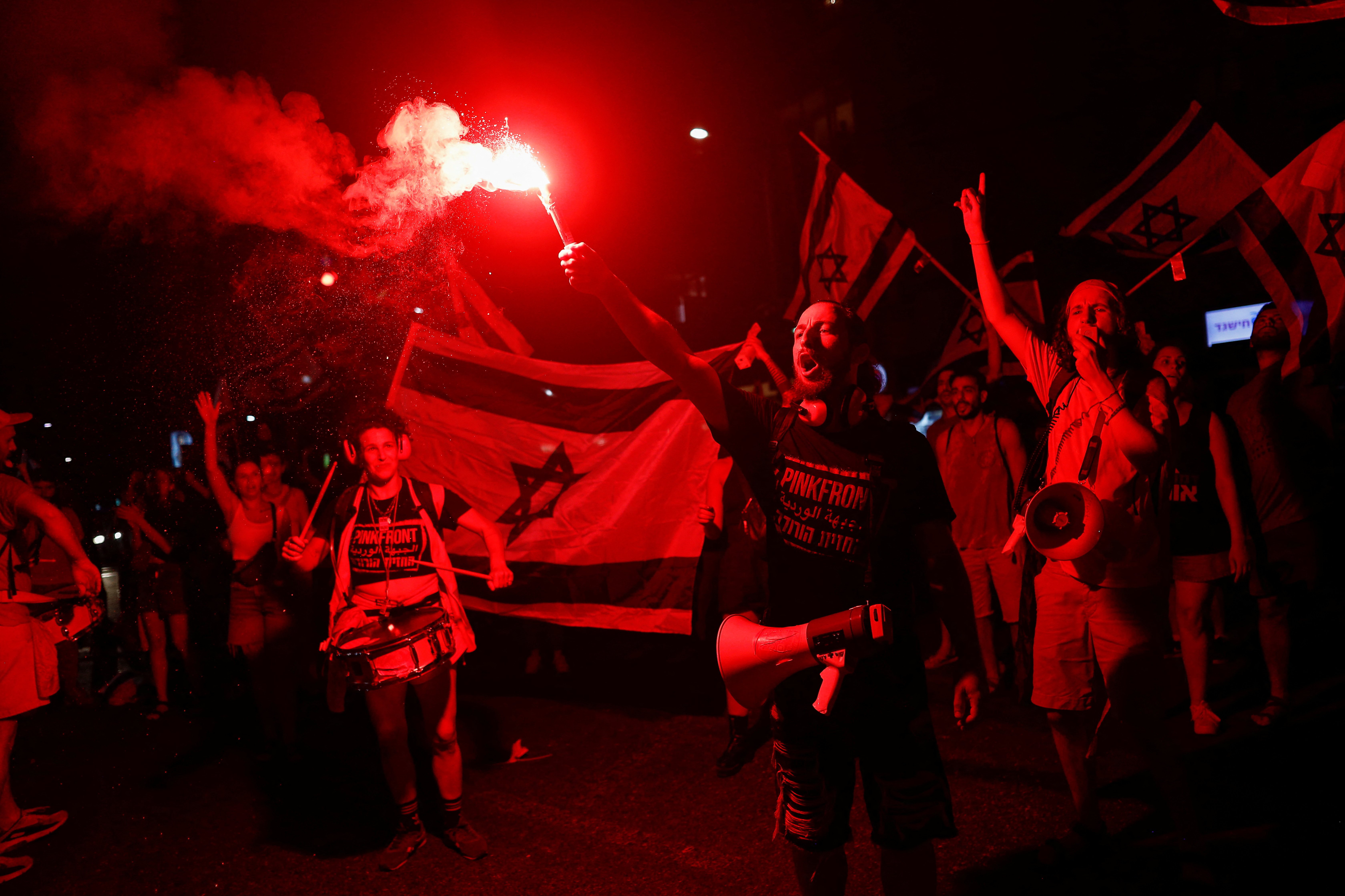 People take part in a demonstration against Israeli Prime Minister Benjamin Netanyahu and his nationalist coalition government's judicial overhaul, in Tel Aviv, Israel, July 22, 2023. REUTERS/Corinna Kern