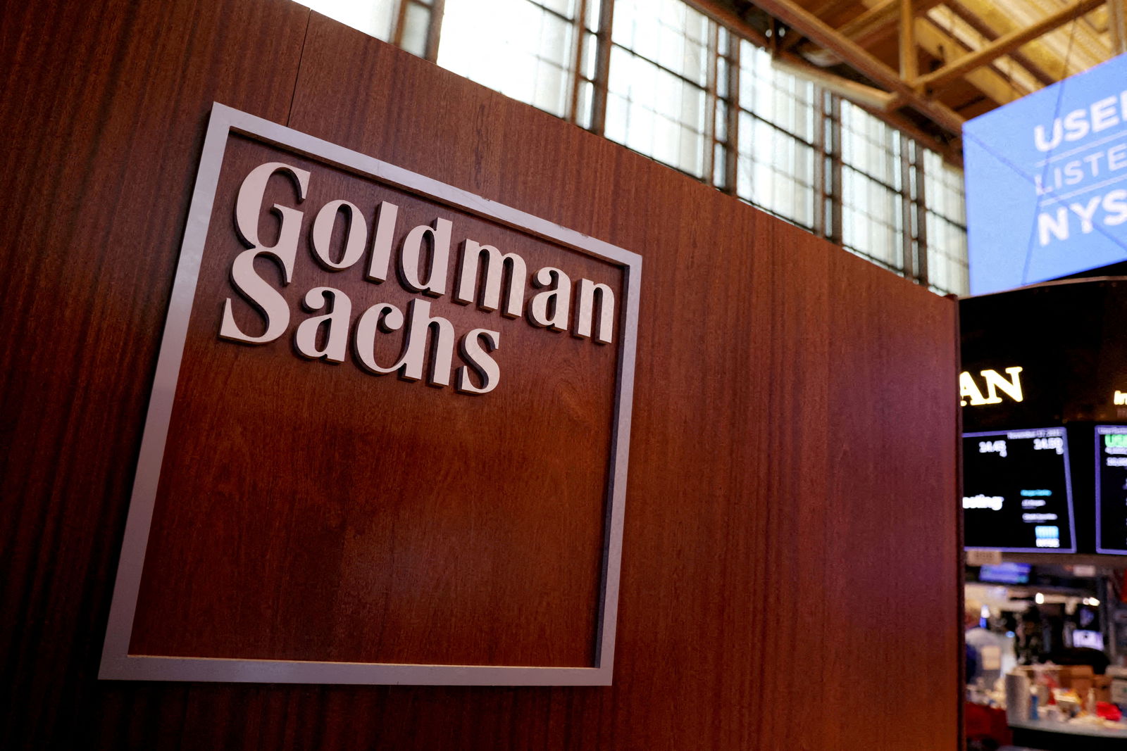 The logo for Goldman Sachs is seen on the trading floor at the New York Stock Exchange (NYSE) in New York City, New York, U.S., November 17, 2021. REUTERS/Andrew Kelly/File Photo