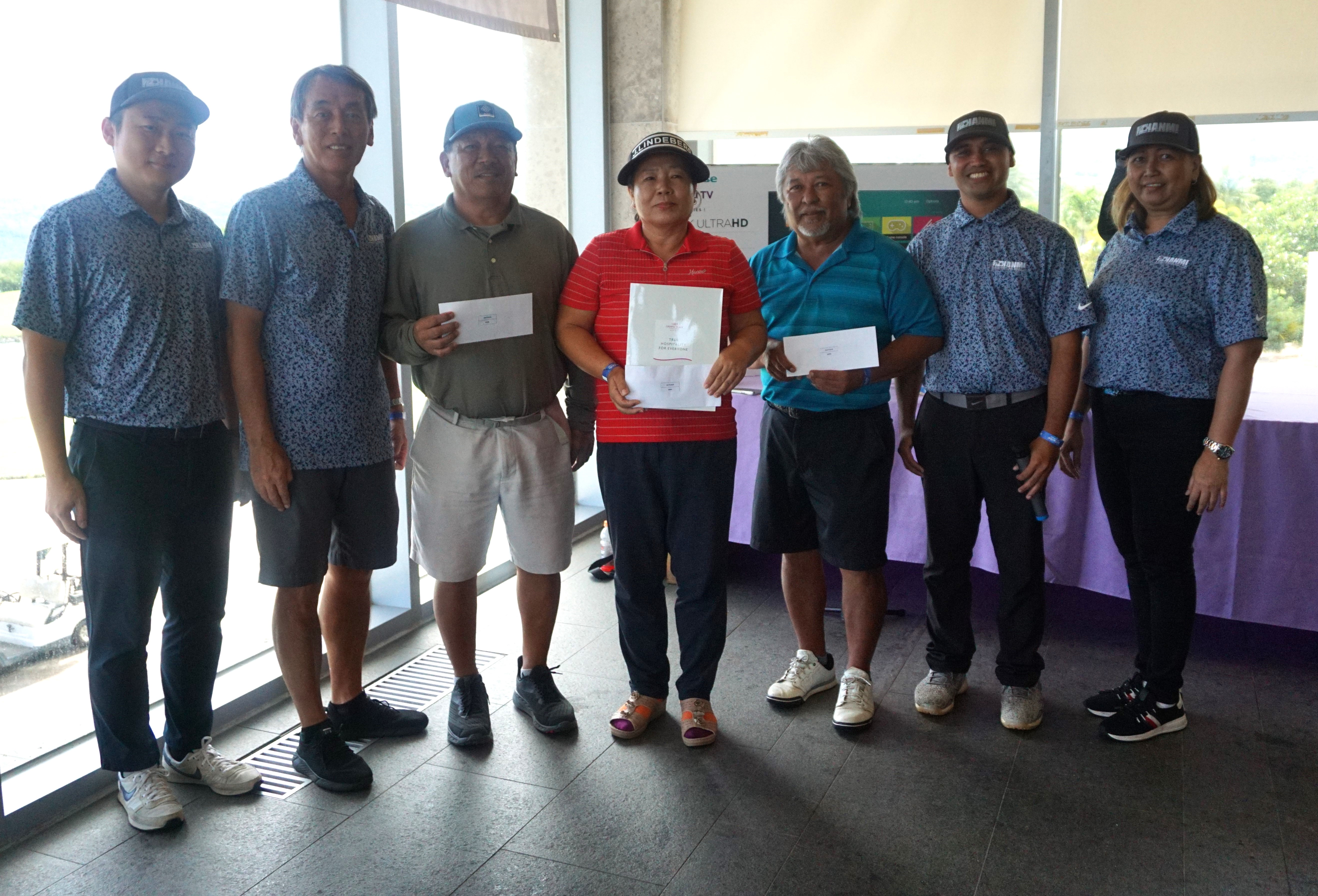 The 21st Annual HANMI Charity Classic Golf Tournament officers Seong-uk Jo, Juko Ishikawa, Franco Santos, and Loida Sabanal, pose with the top three players during the awards ceremony at the Laolao Bay Golf & Resort on Saturday: Ben Duenas, 3rd place; Me Ae Jeon, 1st place; and Joe Sablan, 2nd place.