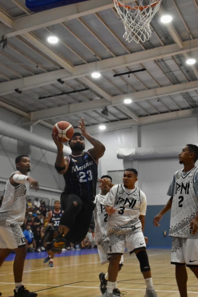 The Marianas' Kelvin Fitial goes up for the finish against Pohnpei during a goodwill basketball game Wednesday at the Ada gym.