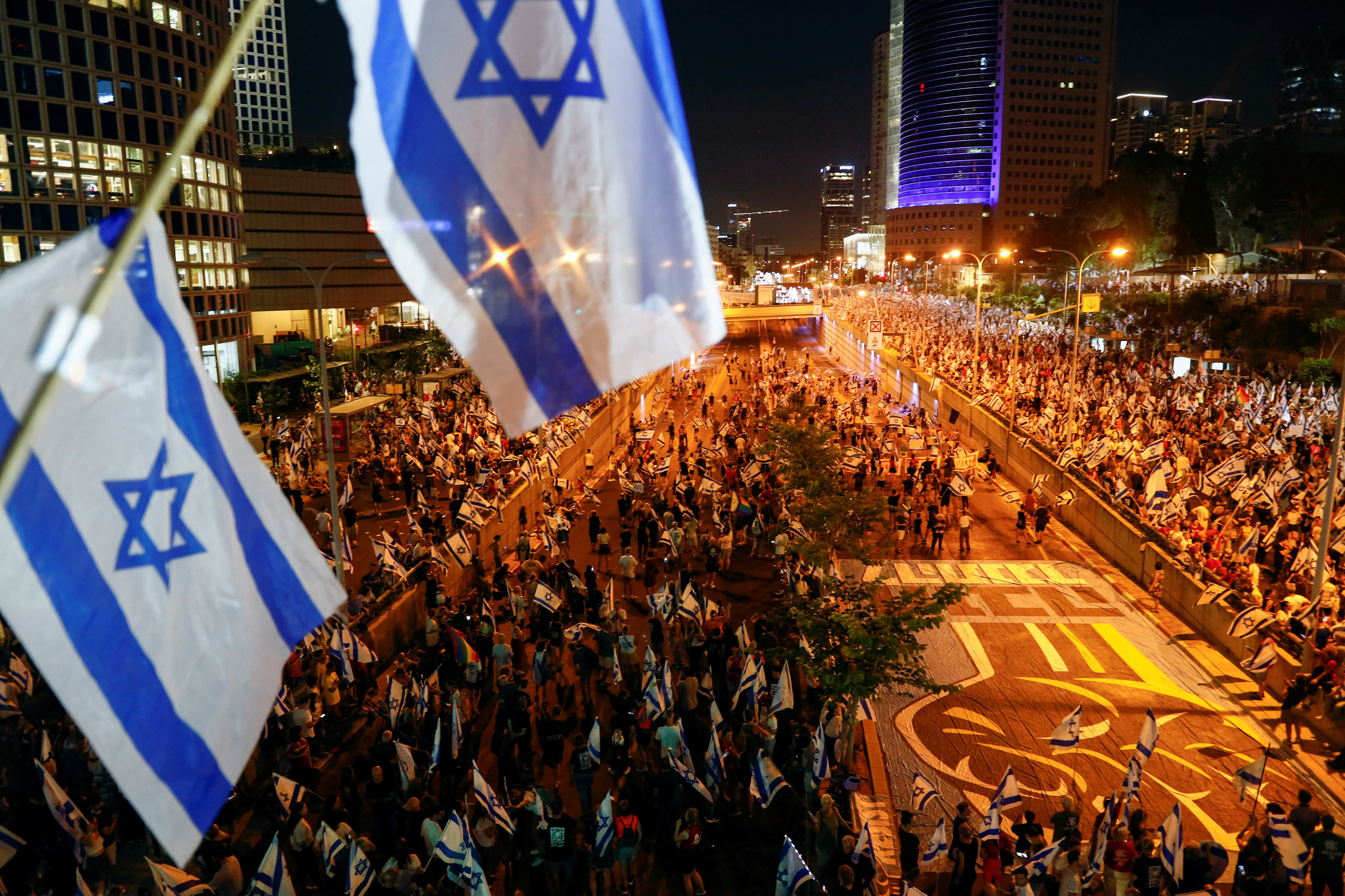 People take part in a demonstration against Israeli Prime Minister Benjamin Netanyahu and his nationalist coalition government's judicial overhaul, in Tel Aviv, Israel, July 22, 2023. REUTERS/Corinna Kern