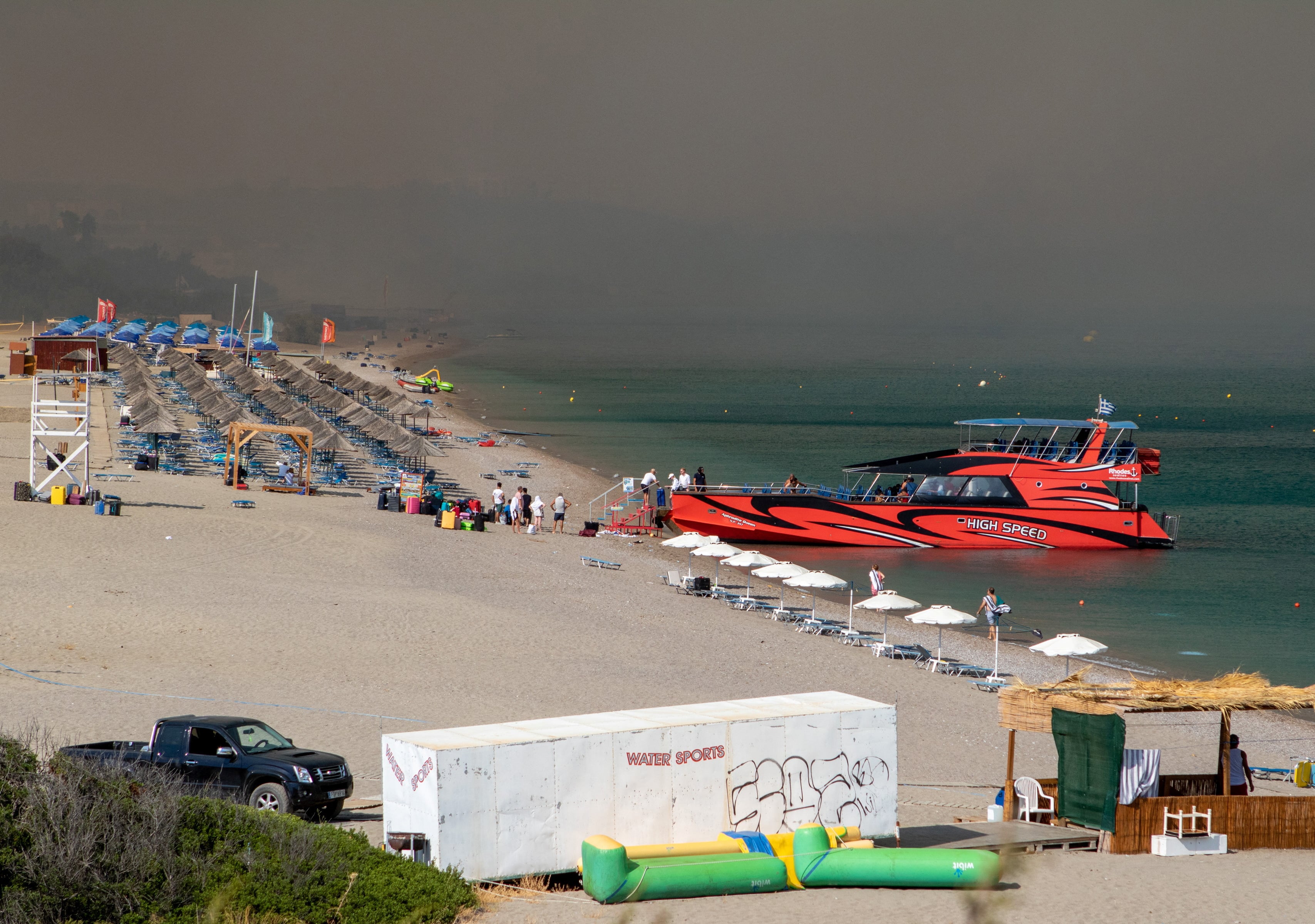 Tourists are being evacuated as wildfire burns near Lindos, on the island of Rhodes, Greece, July 22, 2023. REUTERS/Lefteris Damianidis
