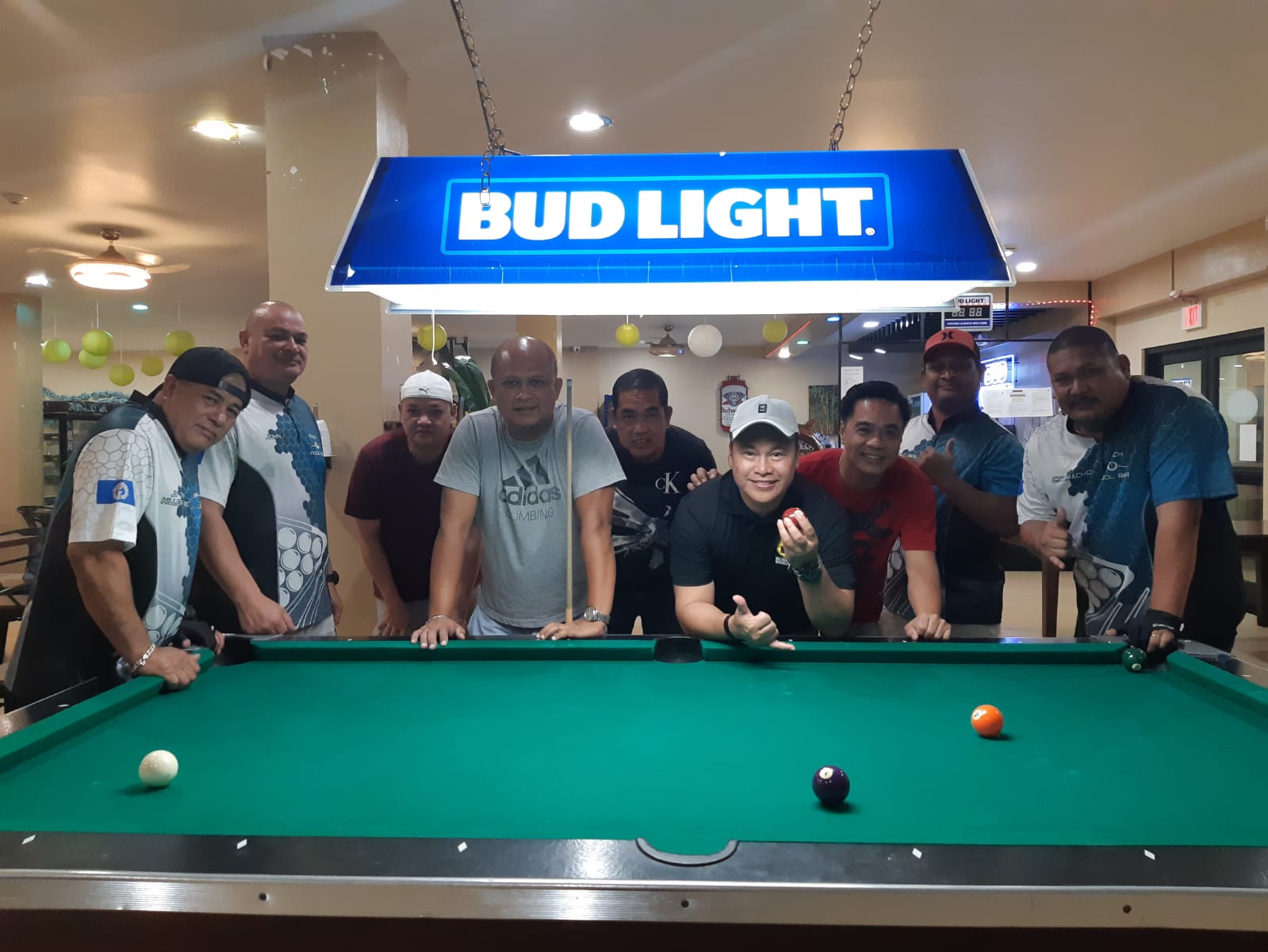 The Rendezvous IT&E Destroyers and the Black 8 Rack n Roll team members pose for a photo after their Tuesday division game in the 2023 SBA Budweiser Open 8-Ball League on Tuesday at Rendezvous Restaurant, Saipan Vegas.