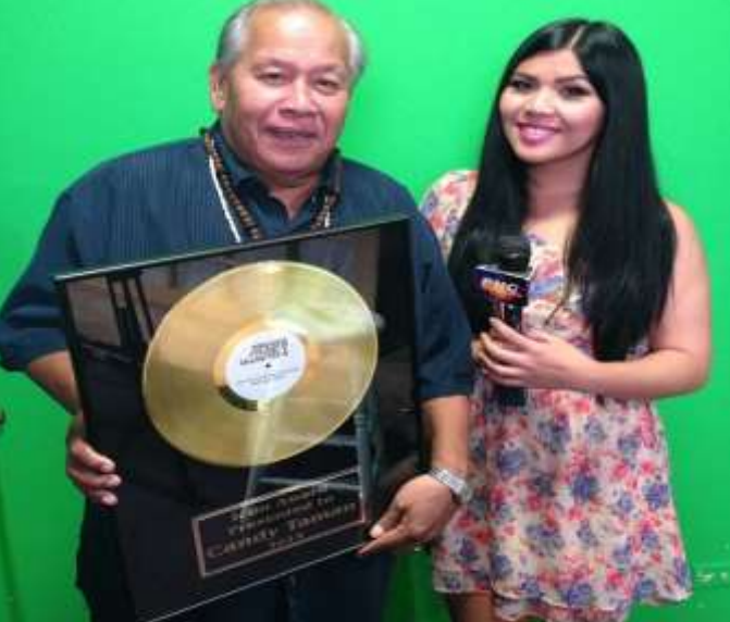  Candy proudly held up his Music Icon Award in 2014.