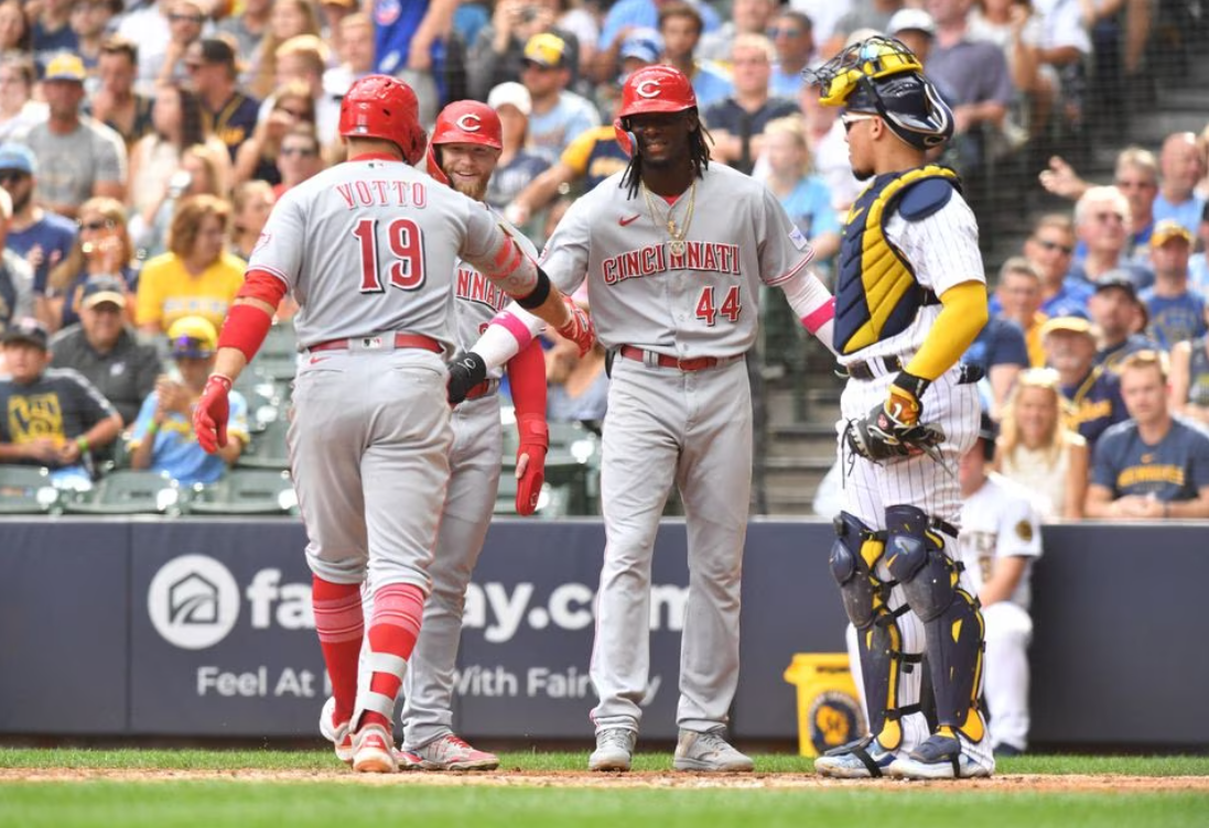 Cincinnati Reds first baseman Joey Votto (19) celebrates his fourth inning home run against the Milwaukee Brewers with left fielder Jake Fraley (27) and shortstop Elly De La Cruz (44) at American Family Field in Milwaukee, Wisconsin, July 8, 2023.