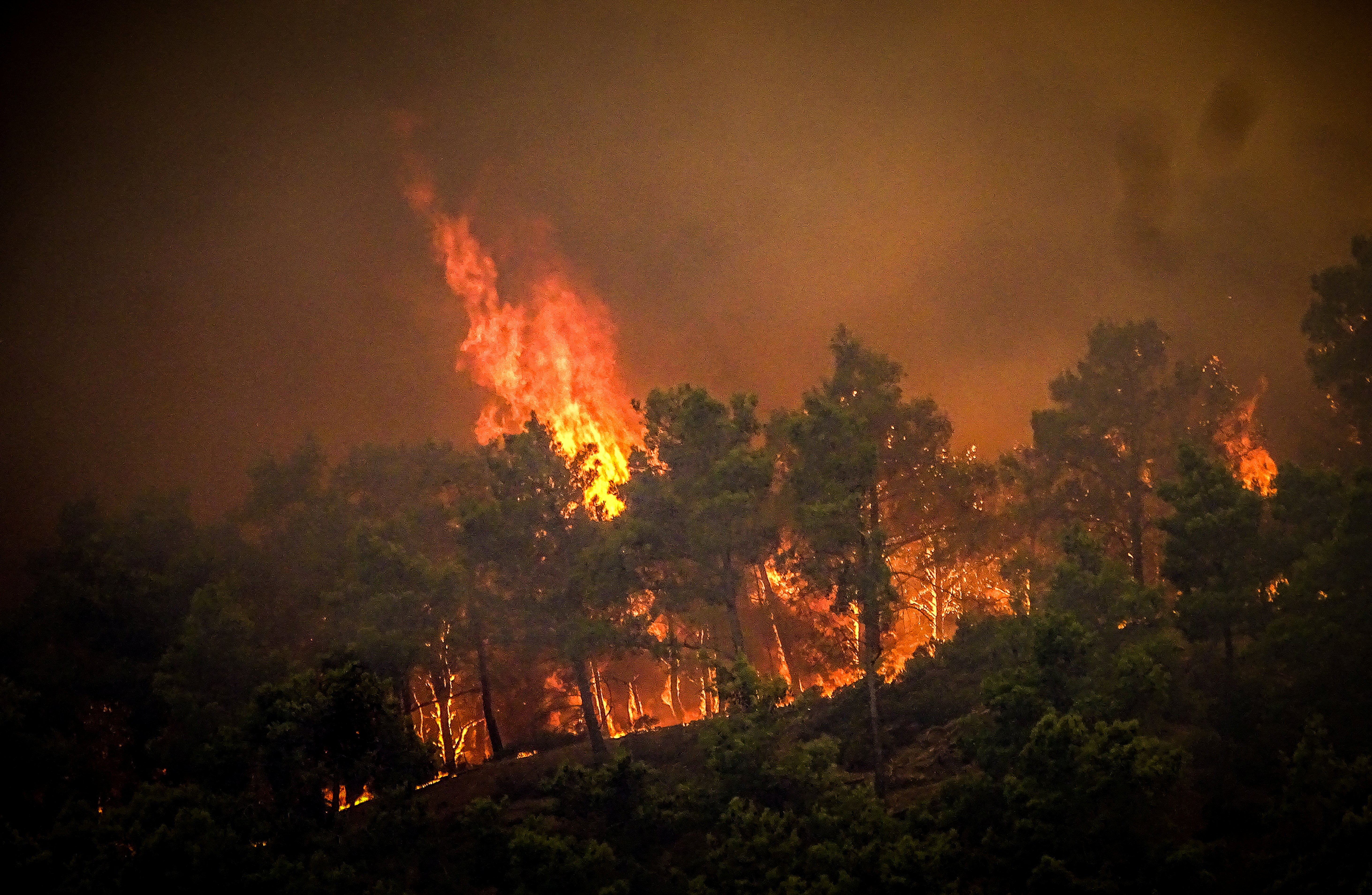 Smoke rises from a wildfire on the island of Rhodes, Greece, July 22, 2023. Argiris Mantikos/Eurokinissi via REUTERS