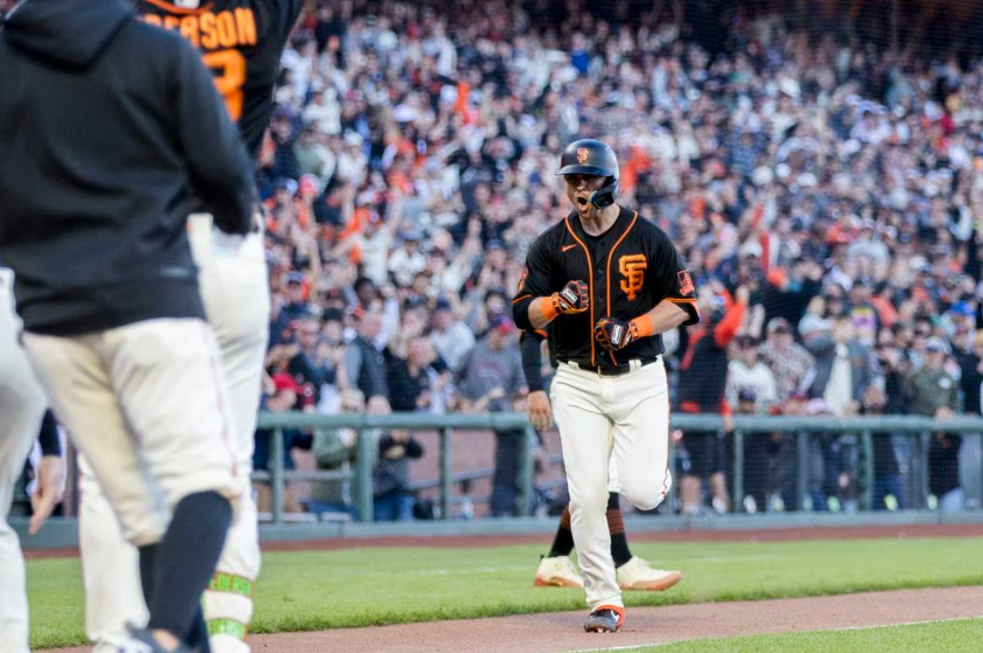 San Francisco Giants third baseman J.D. Davis (7) runs the bases after hitting a solo home run during the ninth inning to defeat the Boston Red Sox at Oracle Park in San Francisco, California, July 29, 2023.