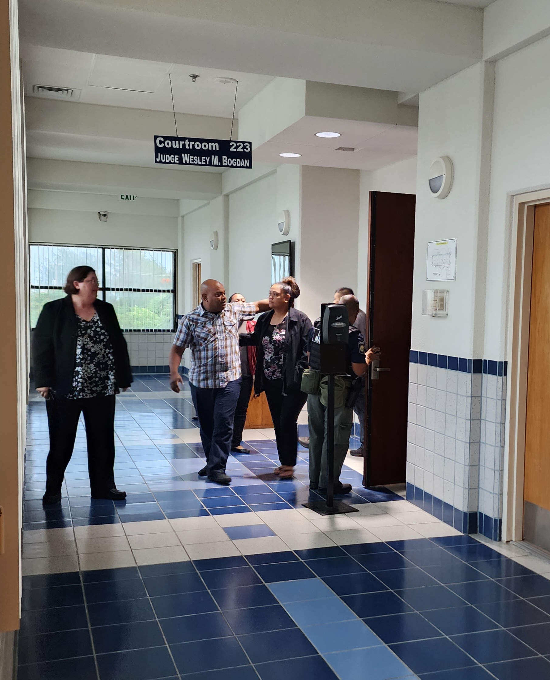 Venitus Ruwaath and his wife leave the courtroom after a jury on Wednesday found him not guilty of sexually abusing a minor in the second degree. Also in  photo is Assistant Public Defender Karrie Comstock.