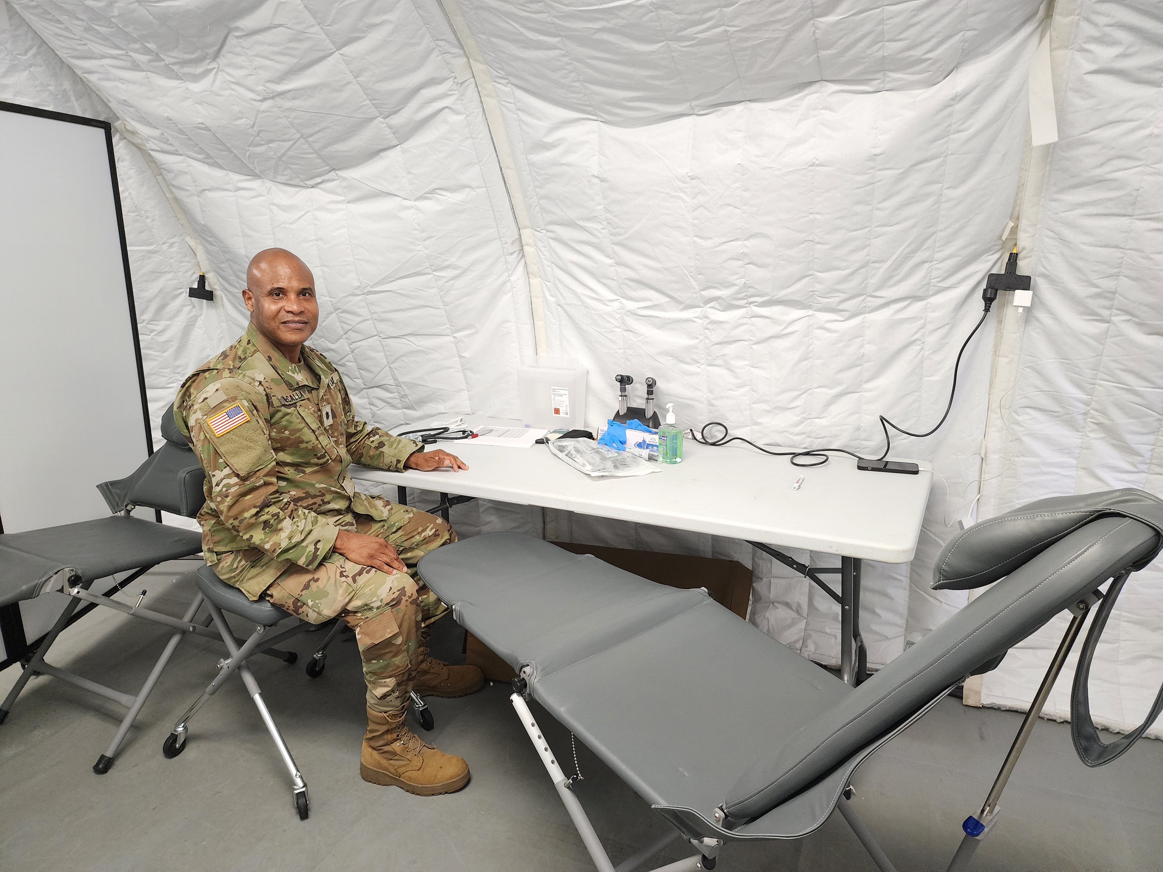 Lt. Col. Carlo McCalla waits for his next patient.