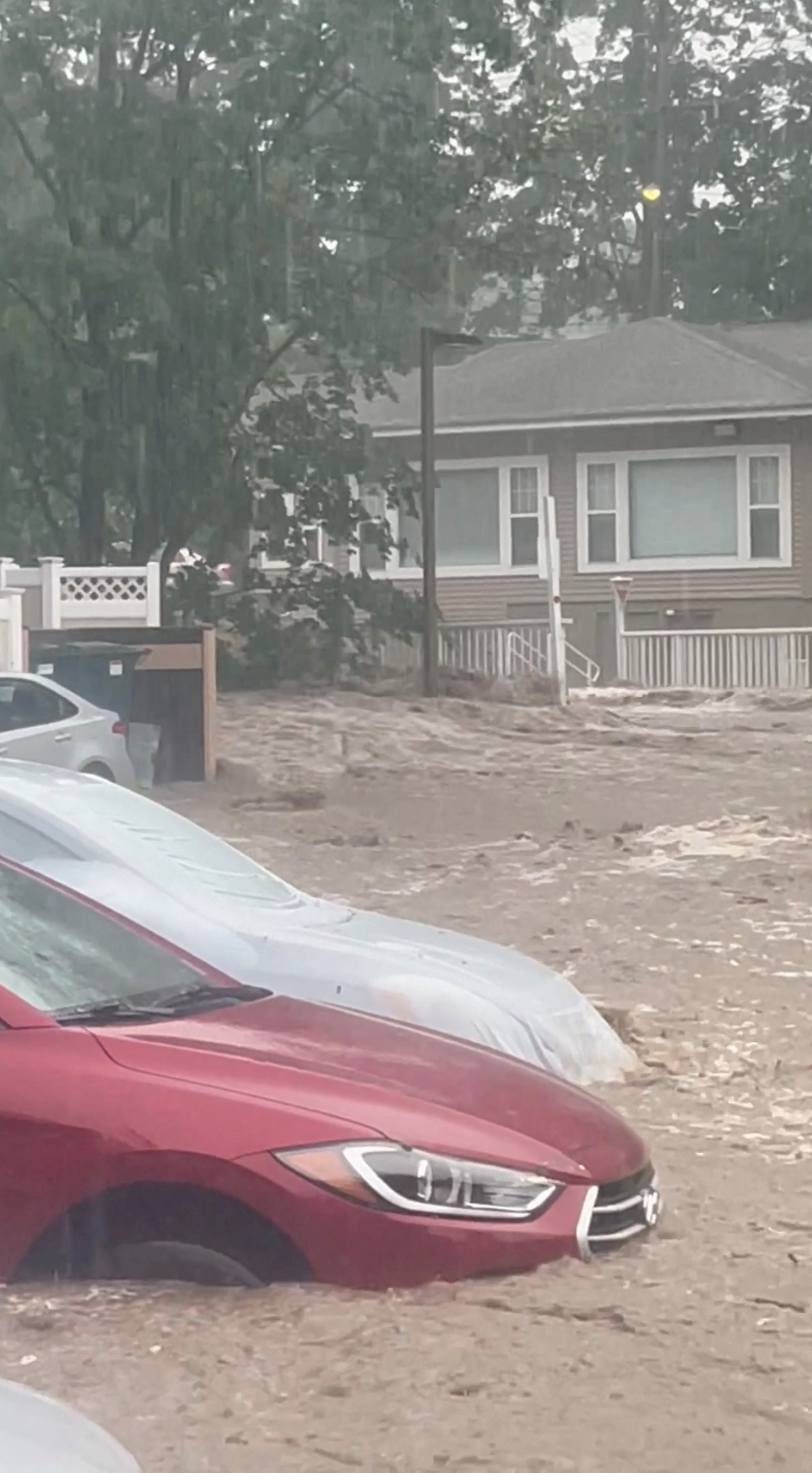Streets are flooded in Highland Falls, Orange County, U.S., in this video screengrab obtained from social media, July 9, 2023. Melissa Roberts/via REUTERS/File photo