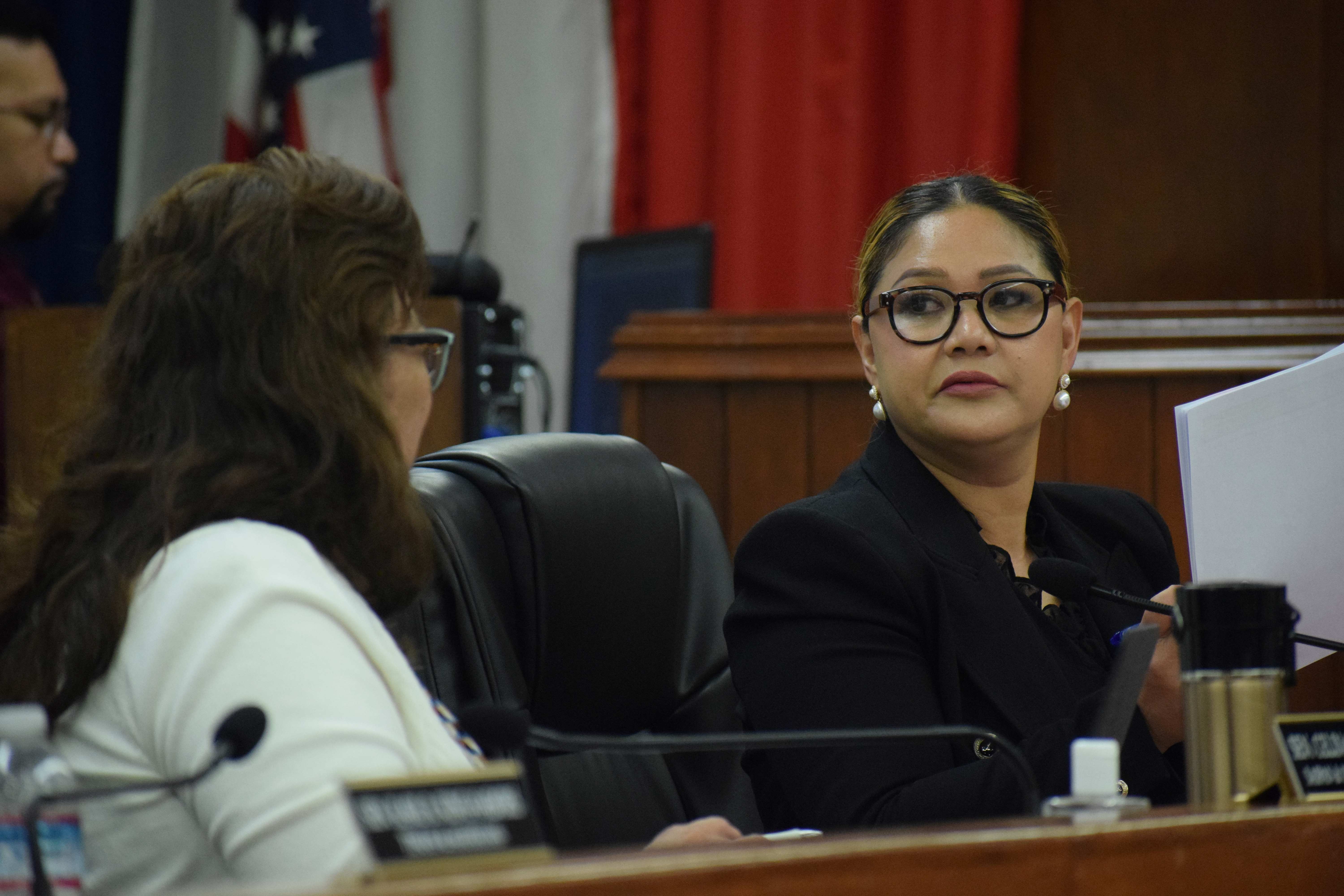 Senate Floor Leader Corina L. Magofna, right, and Sen. Celina R. Babauta confer during a break from a Senate session.