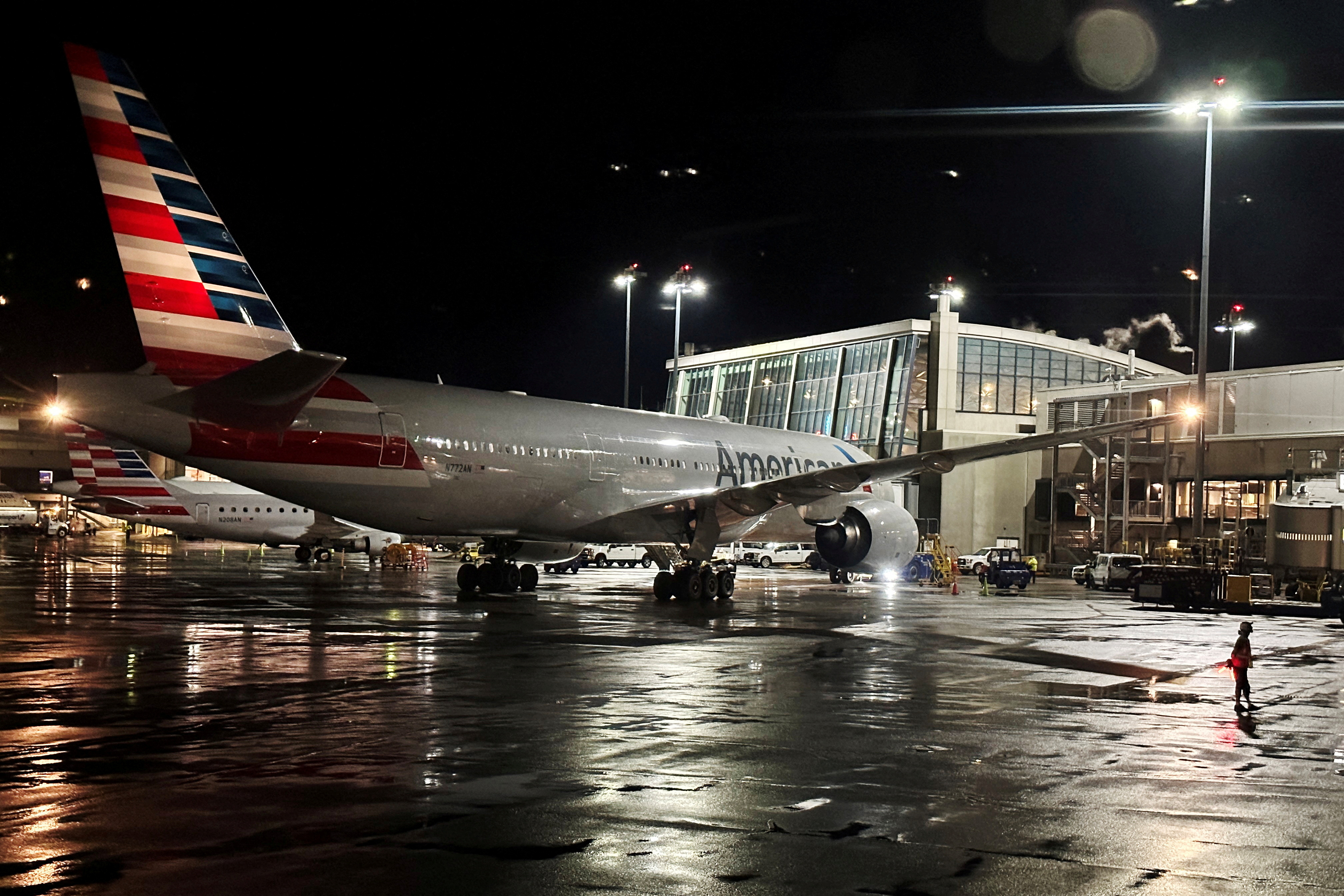 An American Airlines plane sits at a gate at Logan Airport ahead of the July 4th holiday in Boston, Massachusetts, U.S., June 28, 2023. REUTERS/Brian Snyder/File Photo