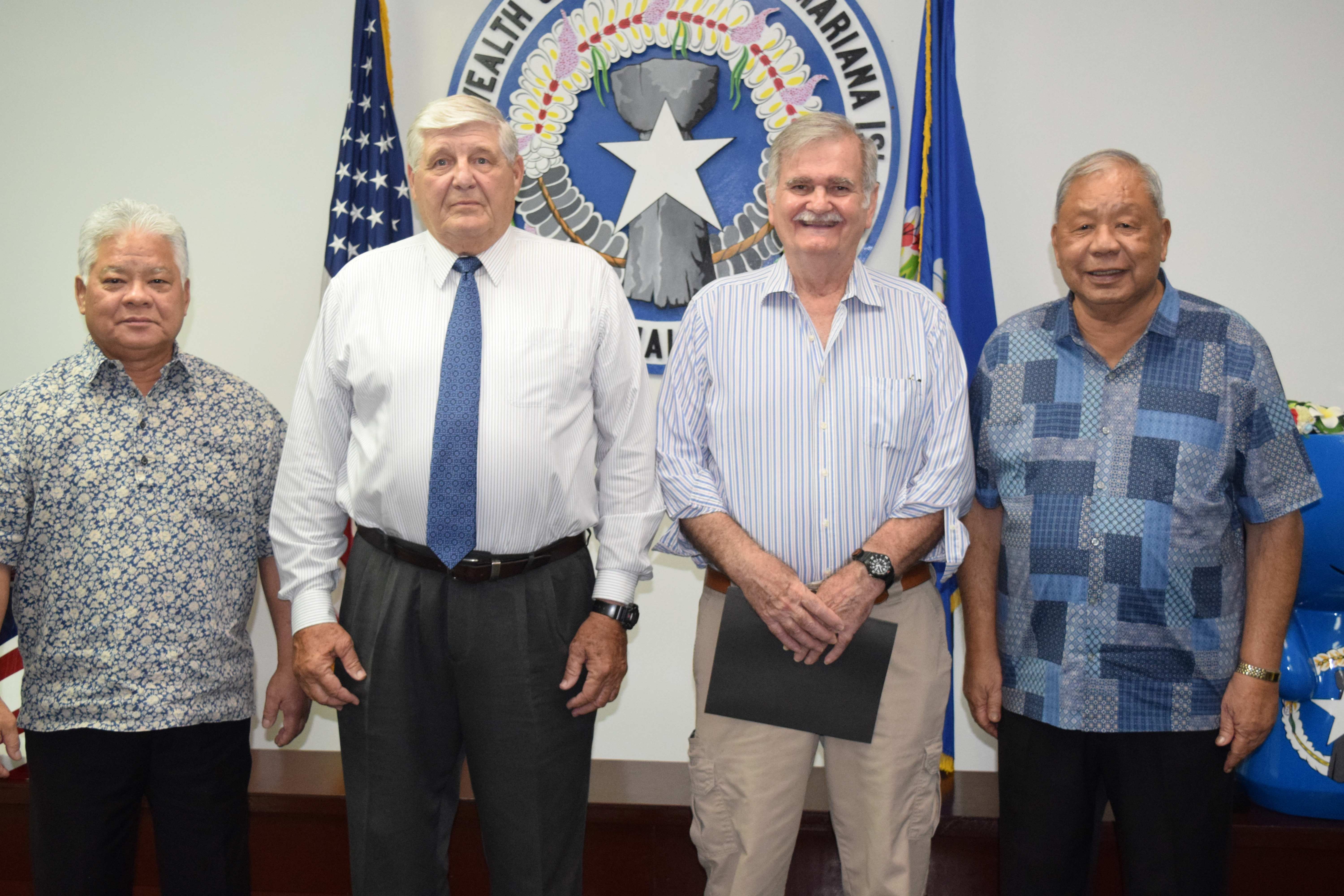 Gov. Arnold I. Palacios, left, and Lt. Gov. David M. Apatang, right, with the newly sworn in Commonwealth Public Utilities Commission members James Sirok, 2nd left, and Dr. John "Jack" Angello, on Friday in the governor's conference room.
