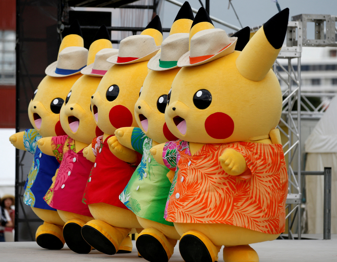 Performers in Pikachu costumes dance at a Splash show and Pokemon Go Park event in Yokohama, Japan, Aug. 9, 2017.
