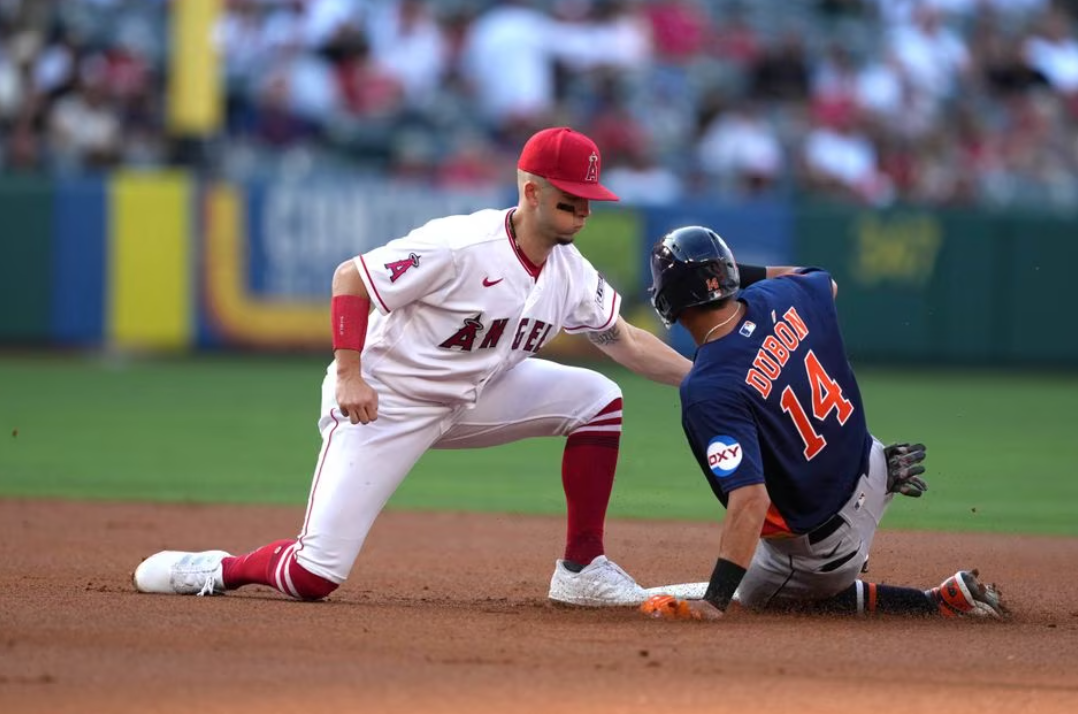Los Angeles Angels shortstop Zach Neto (9) tags out Houston Astros second baseman Mauricio Dubon (14) at second base on a stolen base attempt in the first inning at Angel Stadium in Anaheim, California, July 15, 2023.