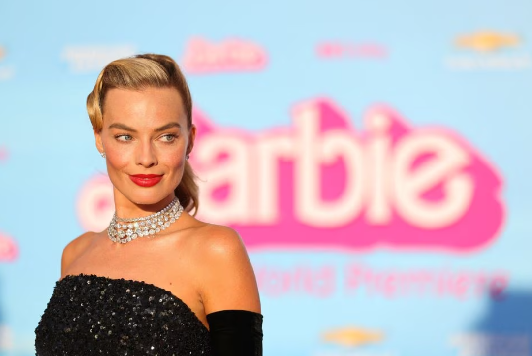 Margot Robbie poses on the pink carpet for the world premiere of the film "Barbie" in Los Angeles, California, July 9, 2023.