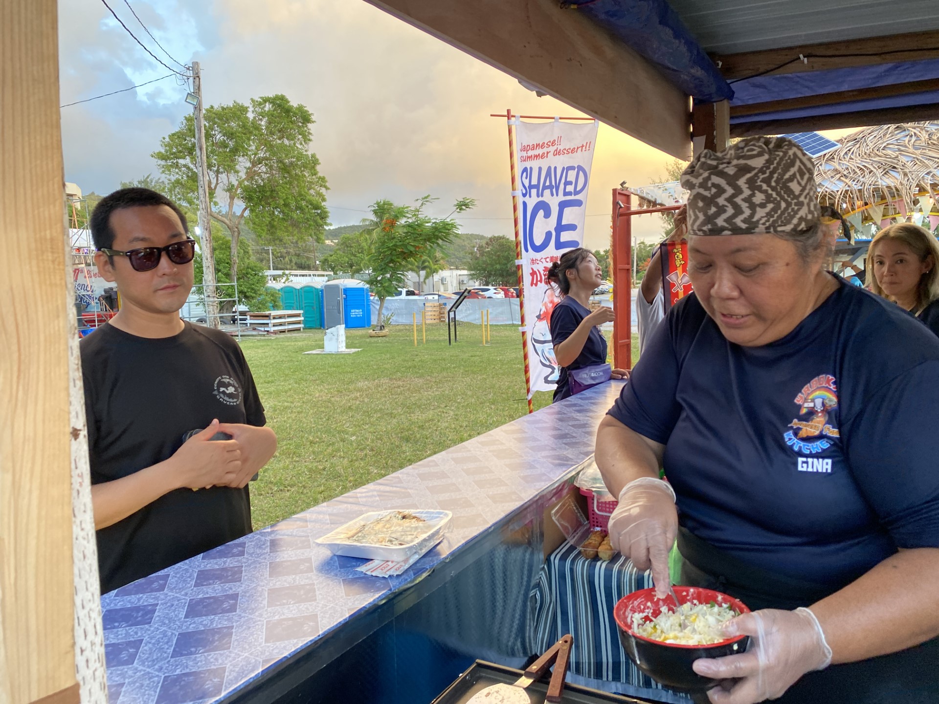 Gina Ignacio of Yadokari Kitchen prepares okonomiyaki at the Liberation Day Carnival in Garapan.