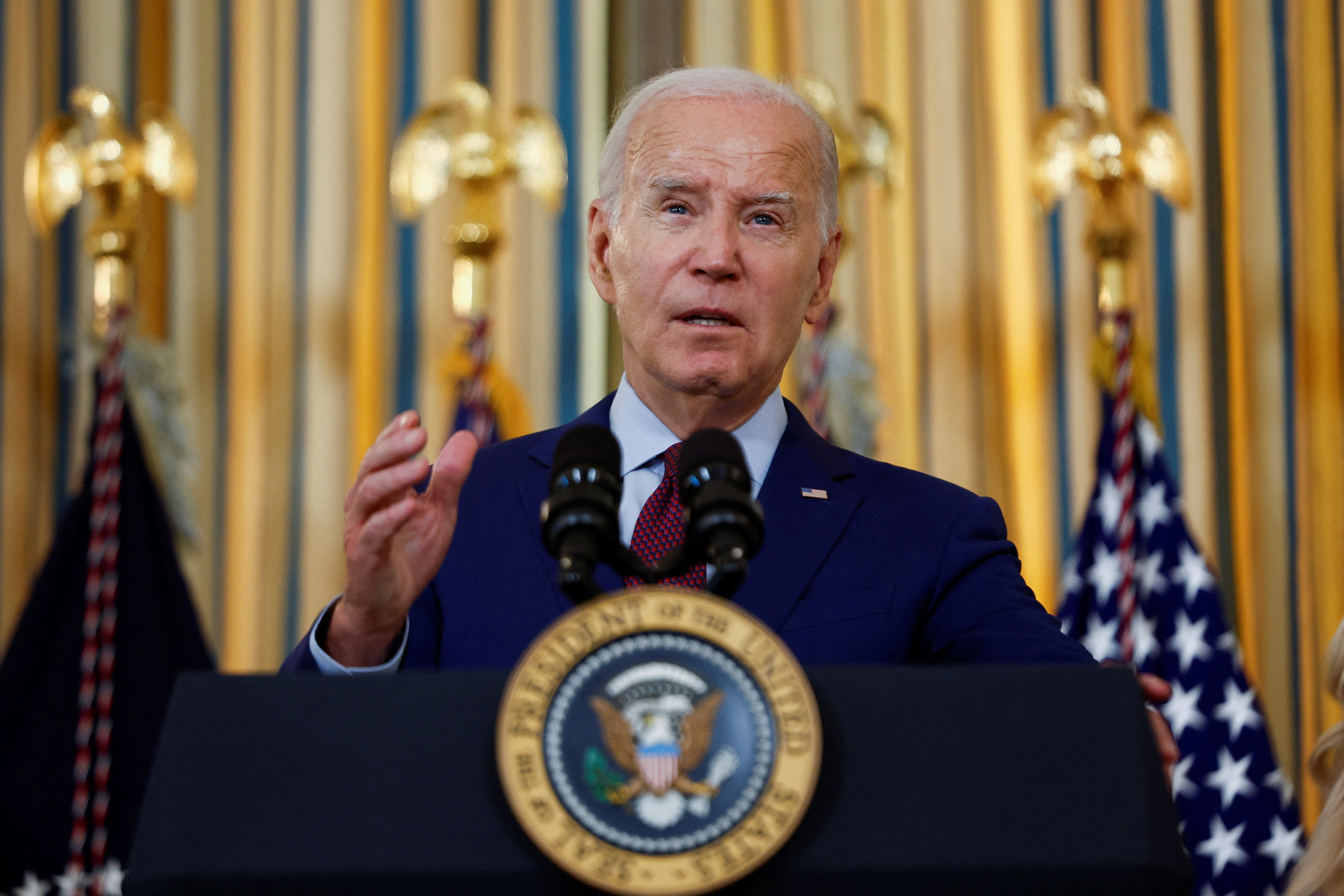 U.S. President Joe Biden speaks as he convenes a meeting of the White House Competition Council in the State Dining room at the White House in Washington, U.S., July 19, 2023. REUTERS/Evelyn Hockstein
