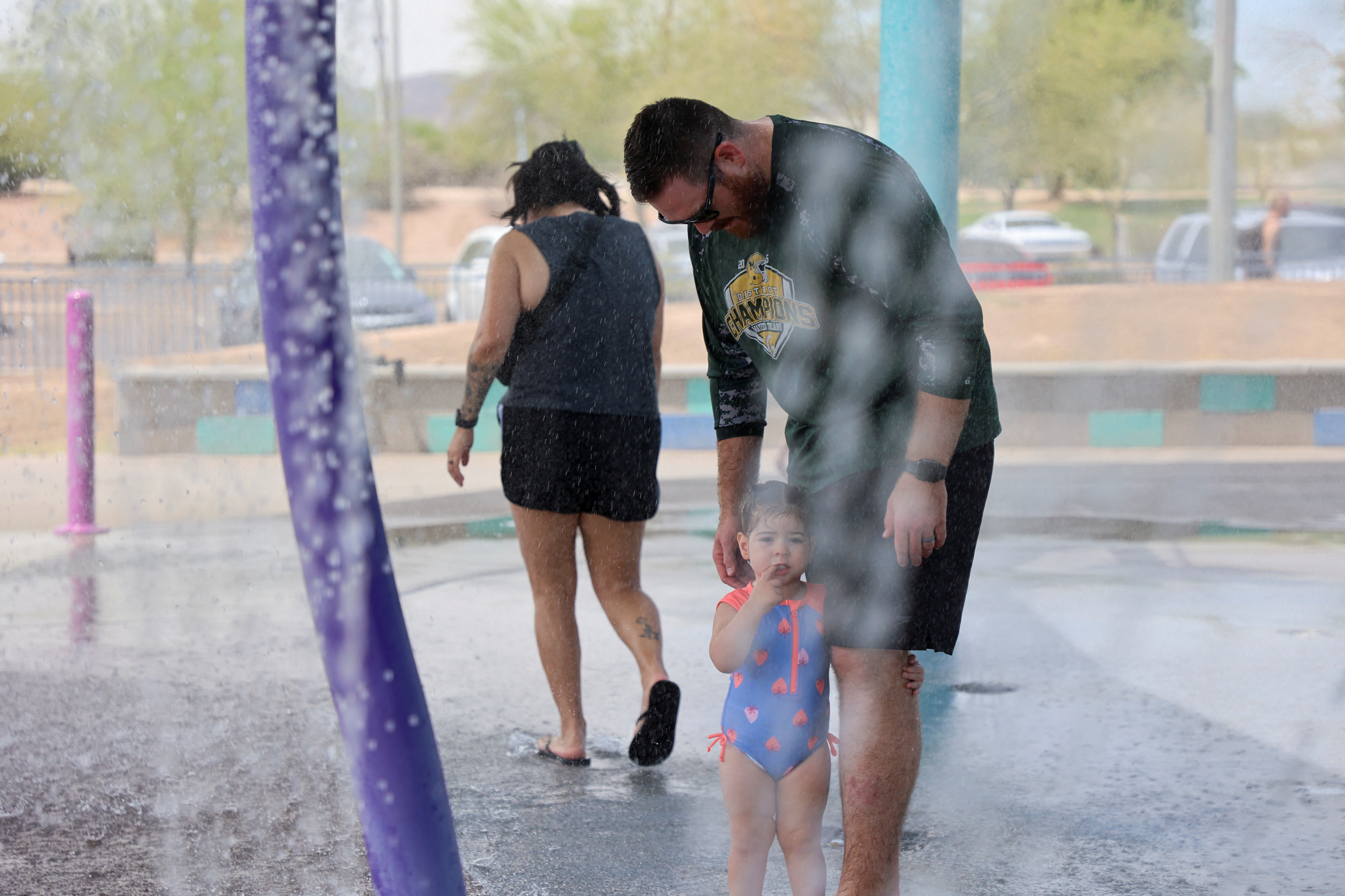 People cool off at a water park during a heatwave in Phoenix, Arizona, U.S., July 16, 2023. REUTERS/Liliana Salgado