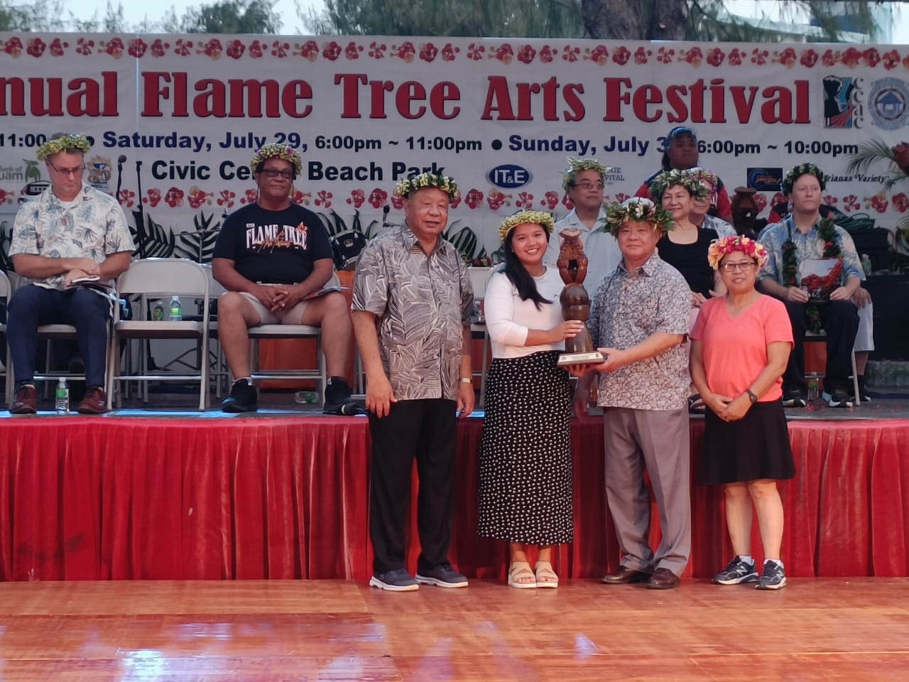 On behalf of Marianas Variety, its sales and marketing supervisor, Hazel Nichole Sadian, receives a token of appreciation as one of the sponsors of the 42nd Annual Flame Tree Festival on Friday.