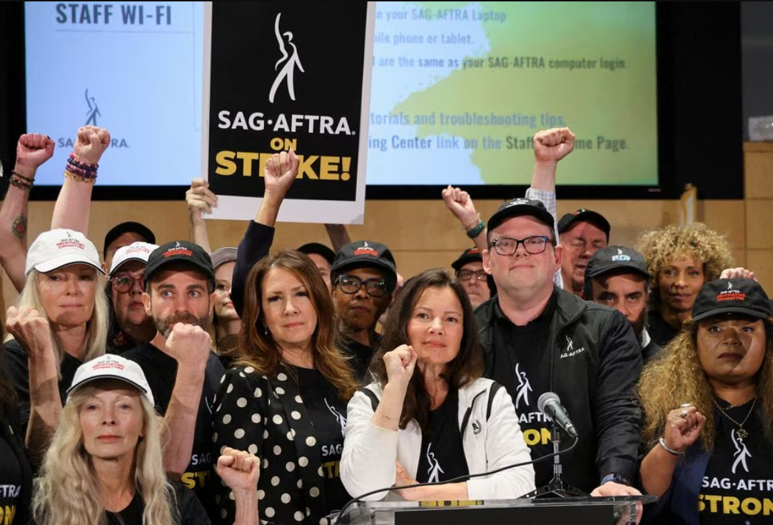 SAG-AFTRA union President Fran Drescher, Duncan Crabtree-Ireland, SAG-AFTRA National Executive Director and Chief Negotiator, and union members gesture at SAG-AFTRA offices after negotiations ended with the Alliance of Motion Picture and Television Producers, triggering an actors’ strike, in Los Angeles, California, July 13, 2023.