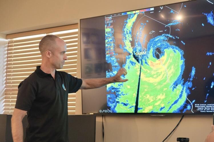 Meteorologist Brandon Aydlett of the National Weather Service gives an assessment on Typhoon Mawar during a meeting at the National Weather Service office in Tiyan, Barrigada, on Friday.