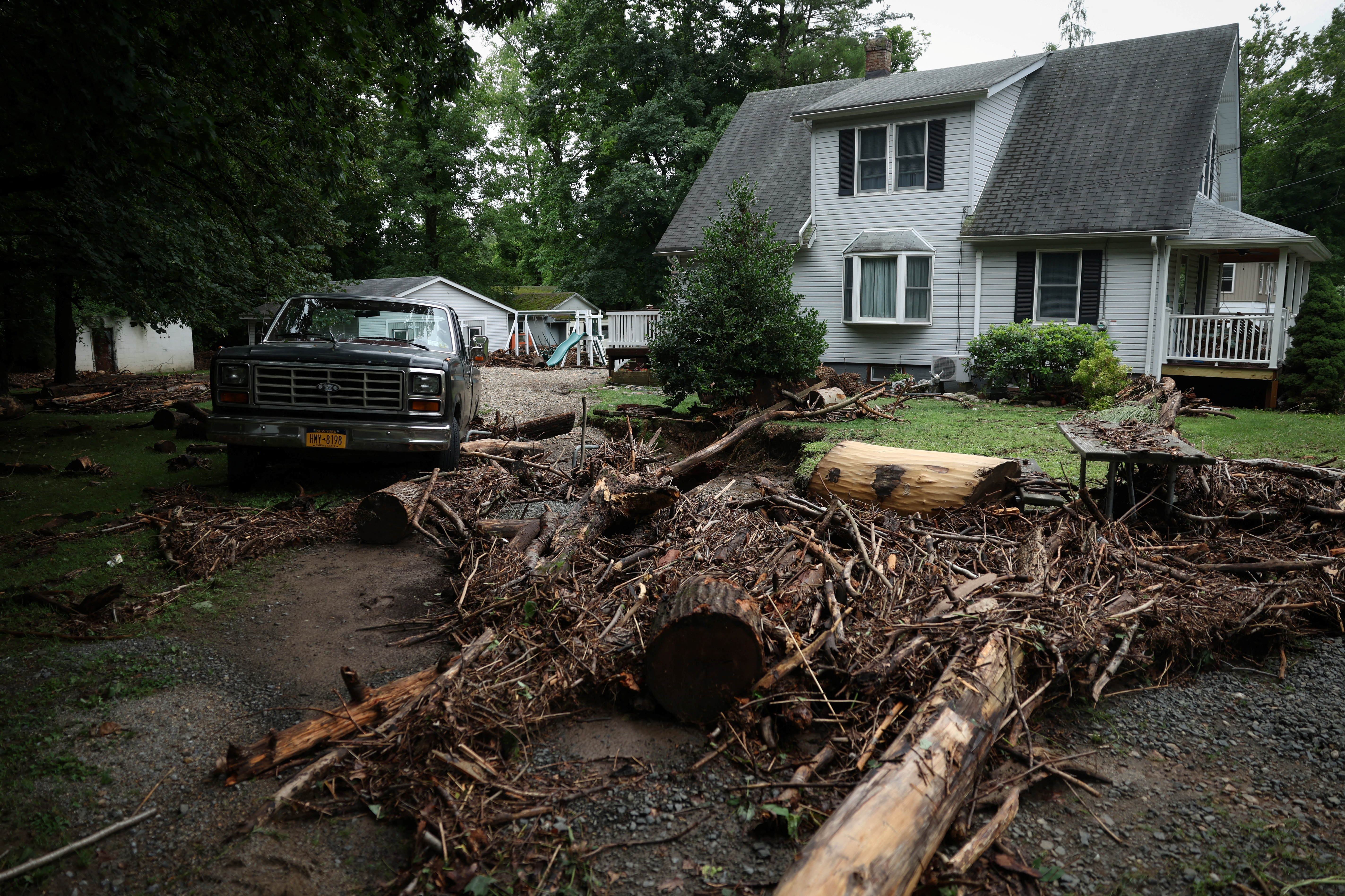 Debris from overnight flooding along Cedar Pond Brook is pictured in Stony Point, New York, U.S., July 10, 2023. REUTERS/Mike Segar