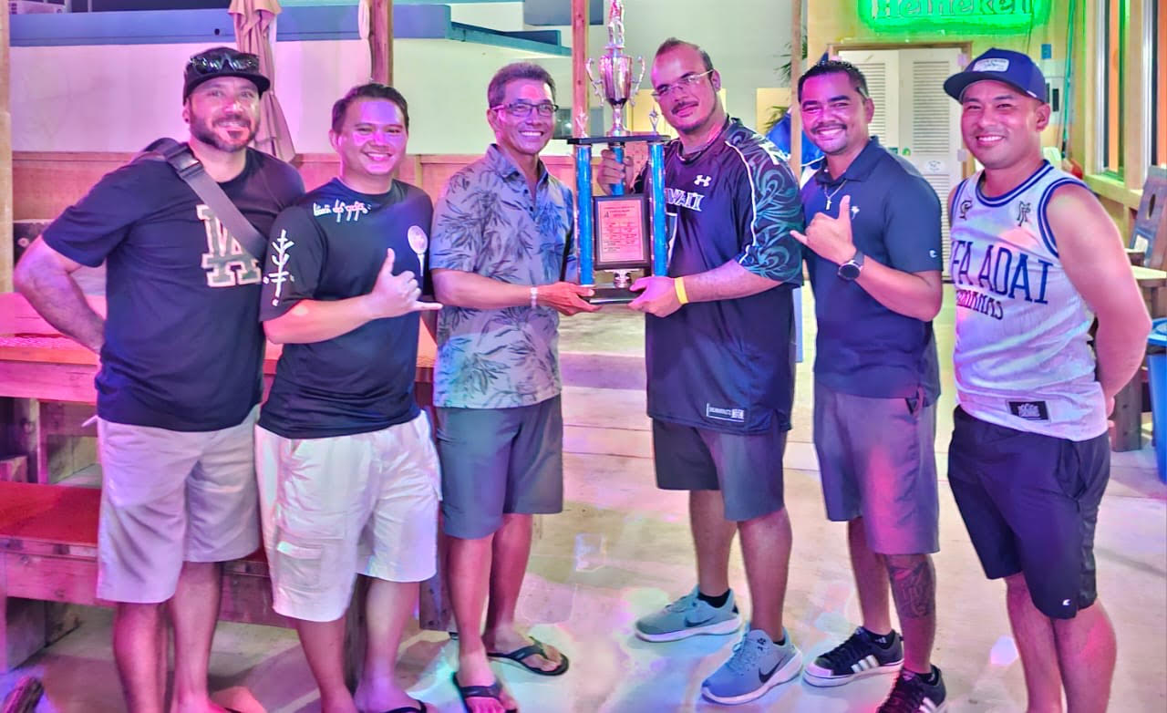 Joseph Sasamoto, third left, holds his Ace of Aces trophy as he poses for a photo with the Marianas Golf Association officers.