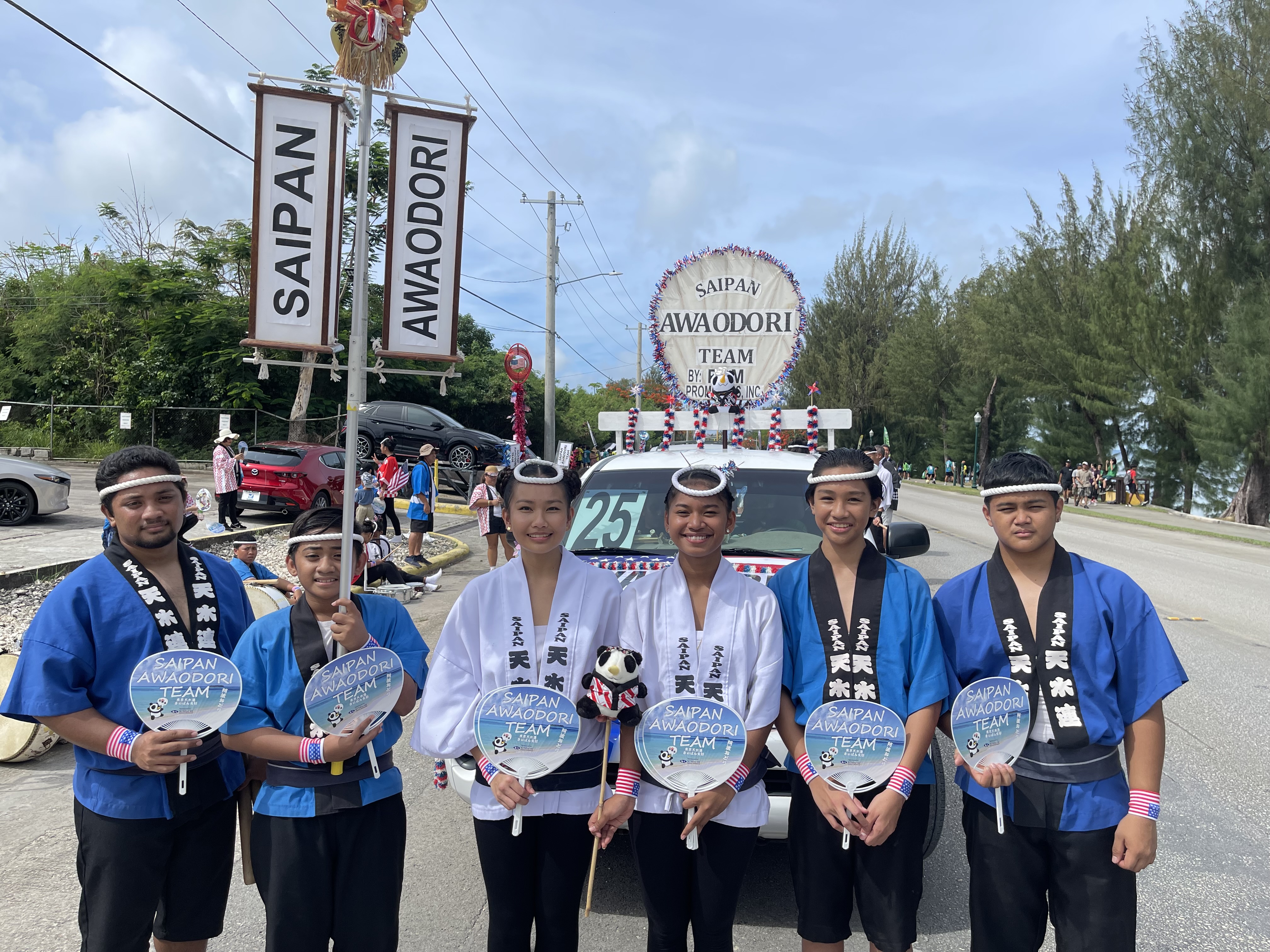 From left, Saipan Awaodori team members Cassidy Thomphson Wabol, Leon Wabol, Jeafanie Tibong, Marcela Heben, Eljan Tibong and Coddie Forbes pose for a photo during the Liberation Day parade on Beach Road in Garapan, Tuesday, July 4, 2023.