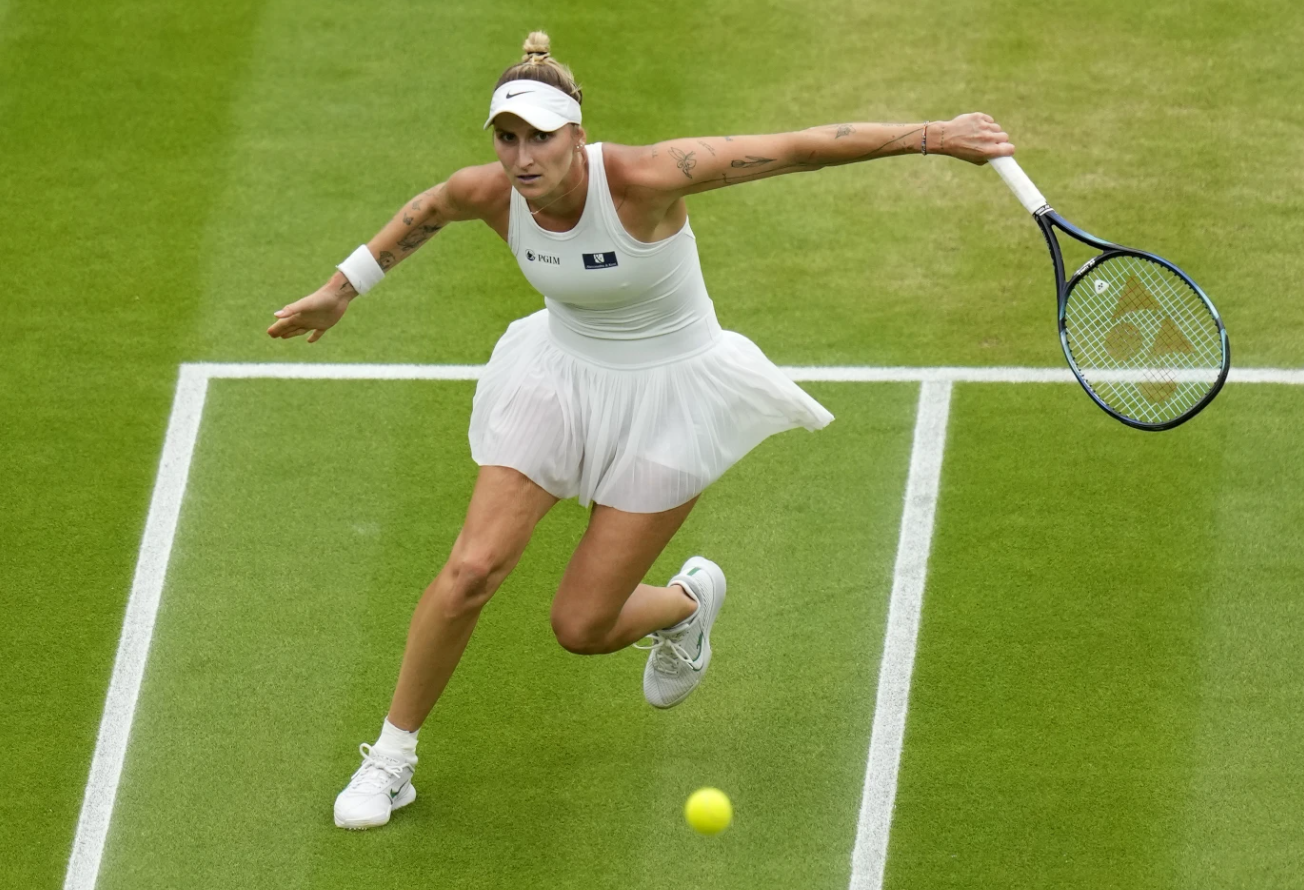 Czech Republic’s Marketa Vondrousova returns to Ukraine’s Elina Svitolina in a women’s singles semifinal match on day 11 of the Wimbledon tennis championships in London, Thursday, July 13, 2023.