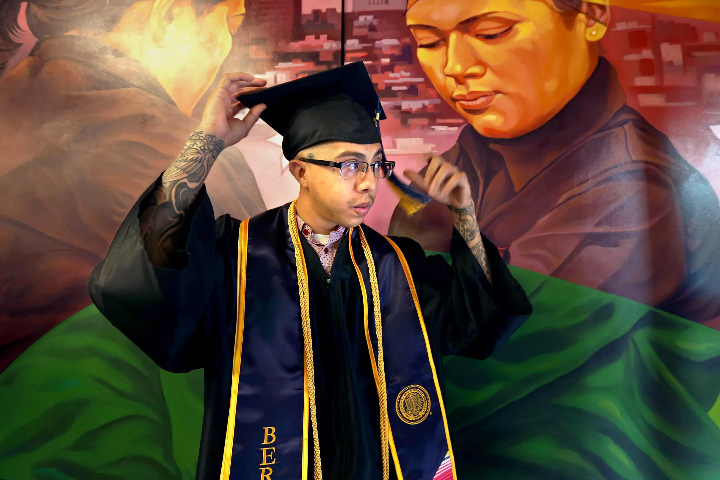 Jessi Fernandez prepares for a celebration of 2023 graduates at Homeboy Industries. Fernandez grew up in Boyle Heights and joined a gang at 13, before turning his life around through education. (Genaro Molina/Los Angeles Times/TNS)