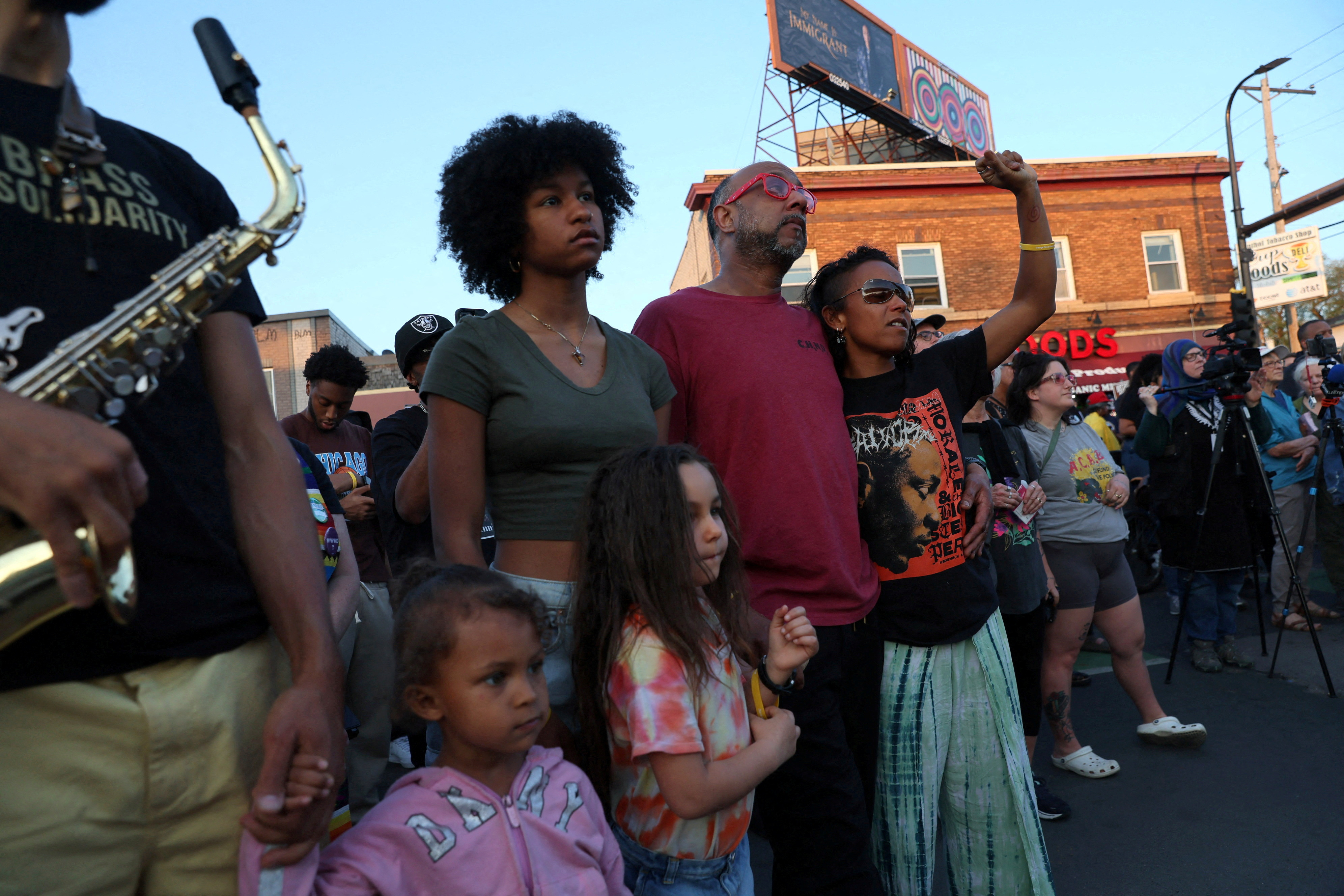 People listen to speakers ahead of a vigil marking the third anniversary of the murder of George Floyd by a police officer in Minneapolis, Minnesota, U.S., May 25, 2023. REUTERS/Leah Millis/File Photo