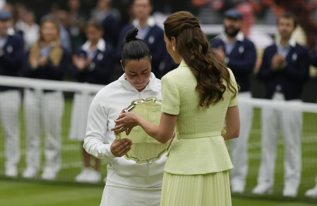 Tunisia’s Ons Jabeur receives her runner up trophy from Britain’s Kate, Princess of Wales, after losing to Czech Republic’s Marketa Vondrousova in the women’s singles final of the Wimbledon tennis championships in London, Saturday, July 15, 2023.